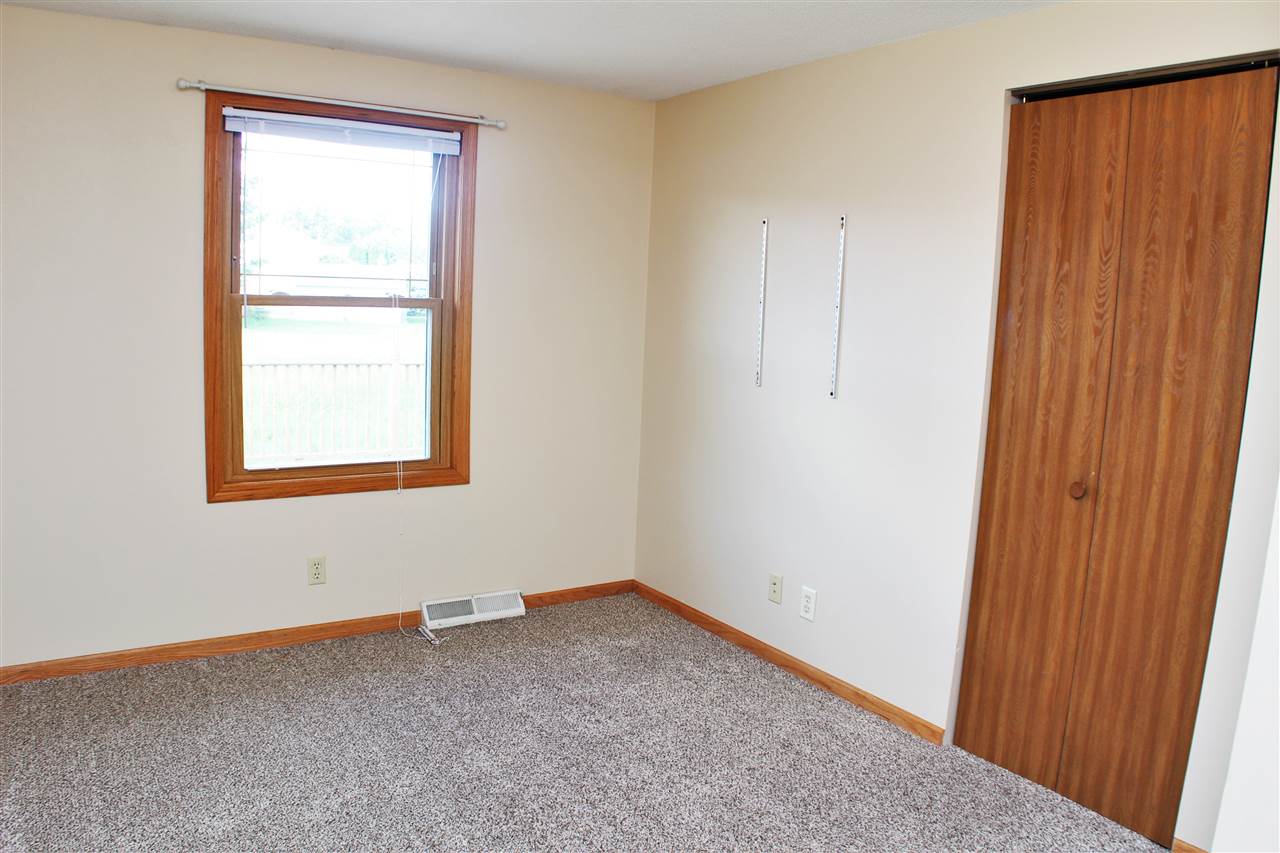 308 Pembroke Road Southwest Poplar Grove, IL 61065 - Photo 16 of 25 an empty room with windows