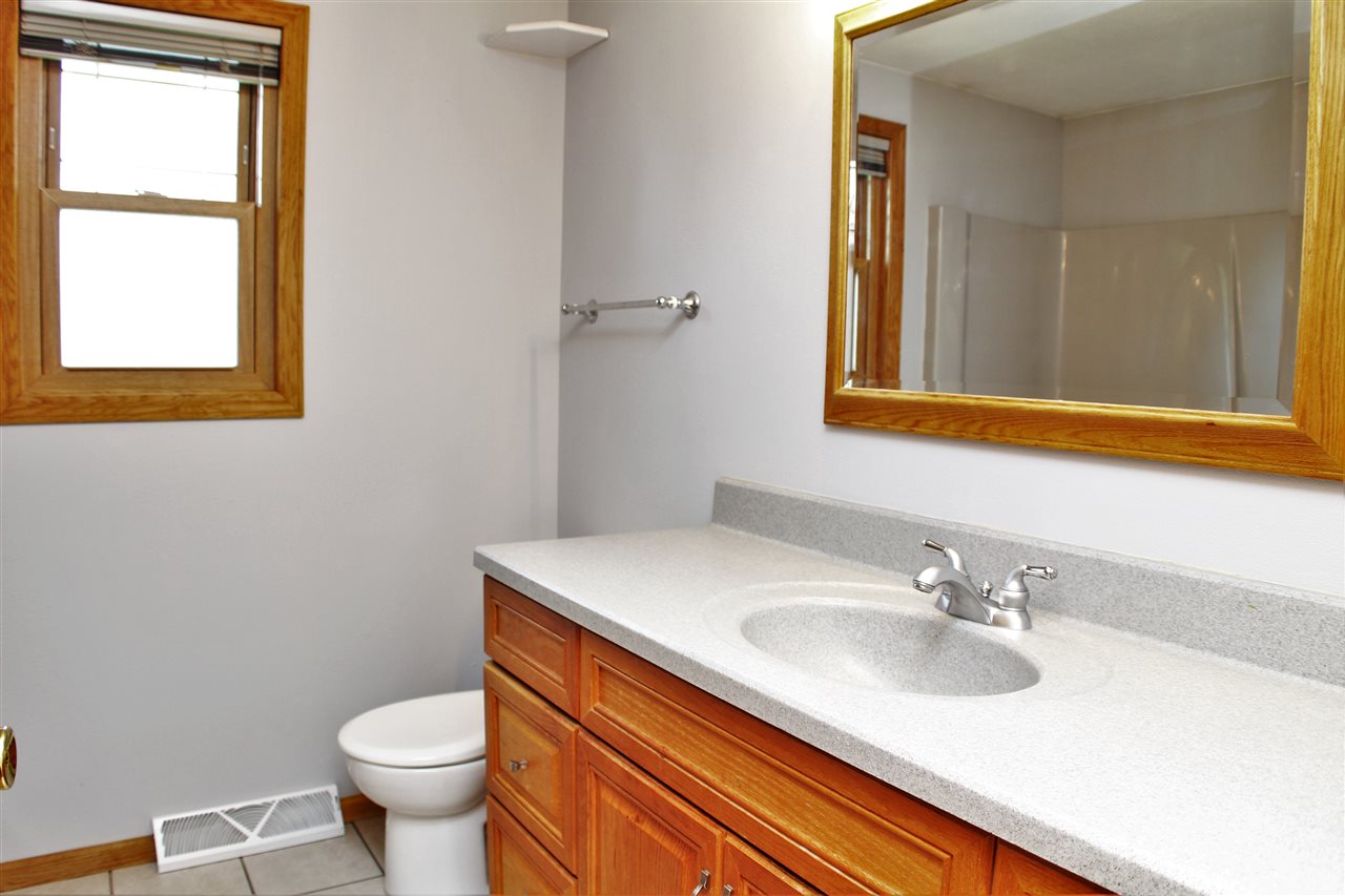 308 Pembroke Road Southwest Poplar Grove, IL 61065 - Photo 18 of 25 a bathroom with a sink and a mirror