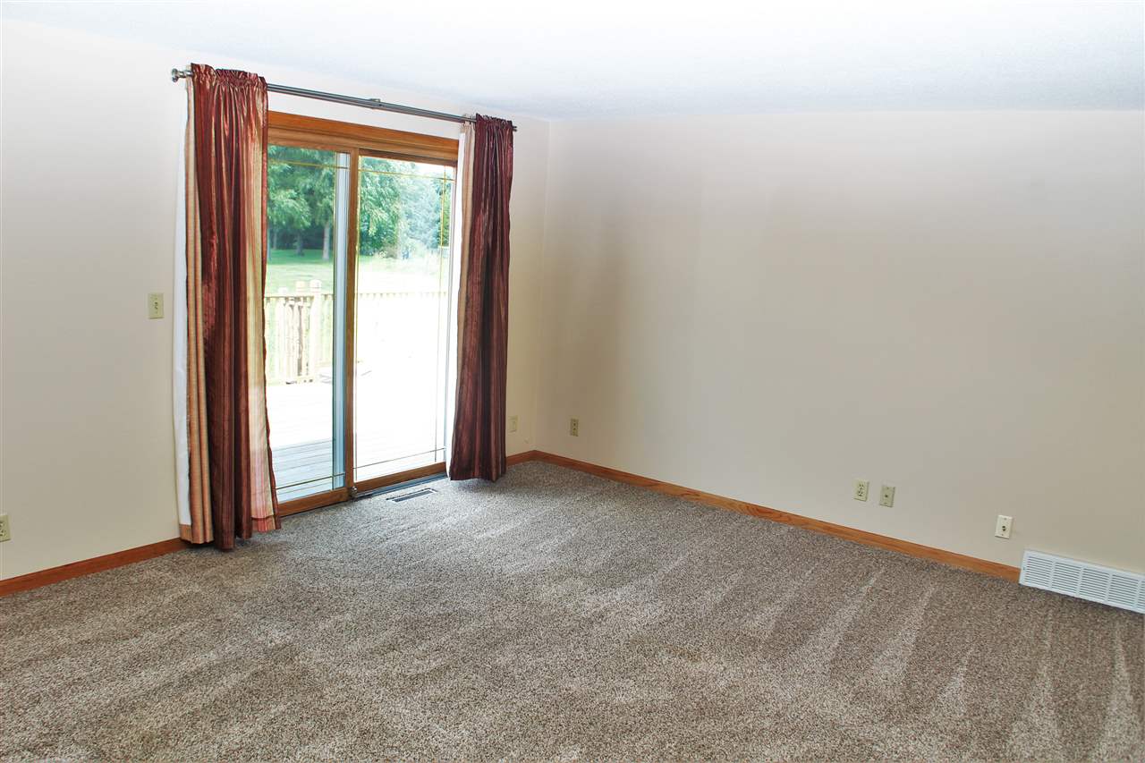308 Pembroke Road Southwest Poplar Grove, IL 61065 - Photo 3 of 25 a view of an empty room with a window