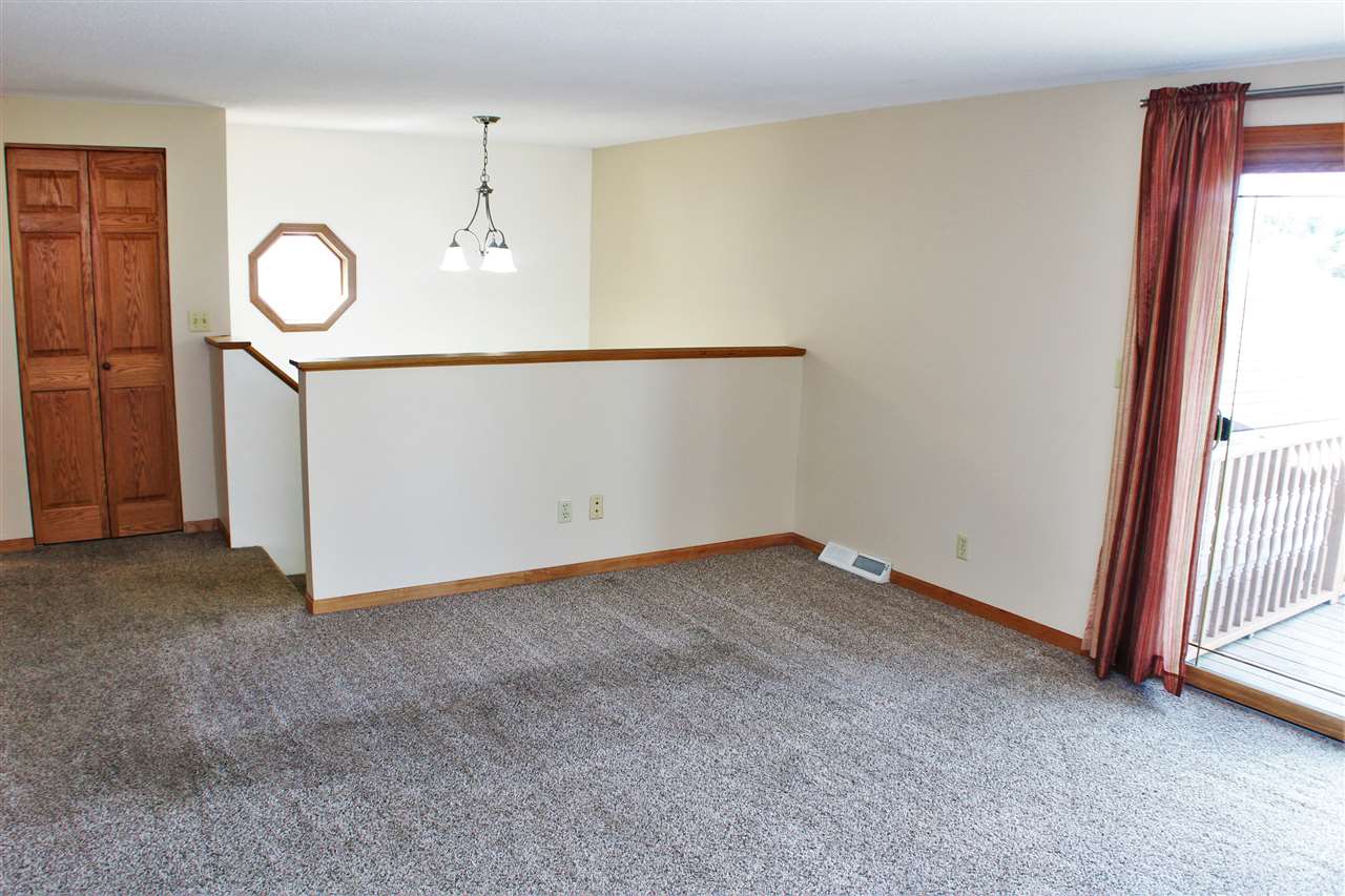 308 Pembroke Road Southwest Poplar Grove, IL 61065 - Photo 4 of 25 a view of a room with wooden floor and window