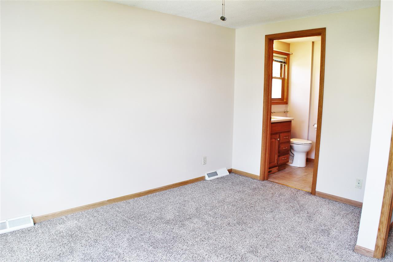 308 Pembroke Road Southwest Poplar Grove, IL 61065 - Photo 10 of 25 an empty room and a bathroom