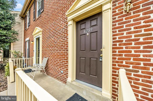 a view of a brick wall and a window