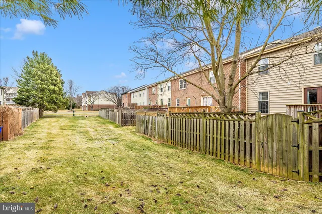 a kitchen with a refrigerator sink and cabinets