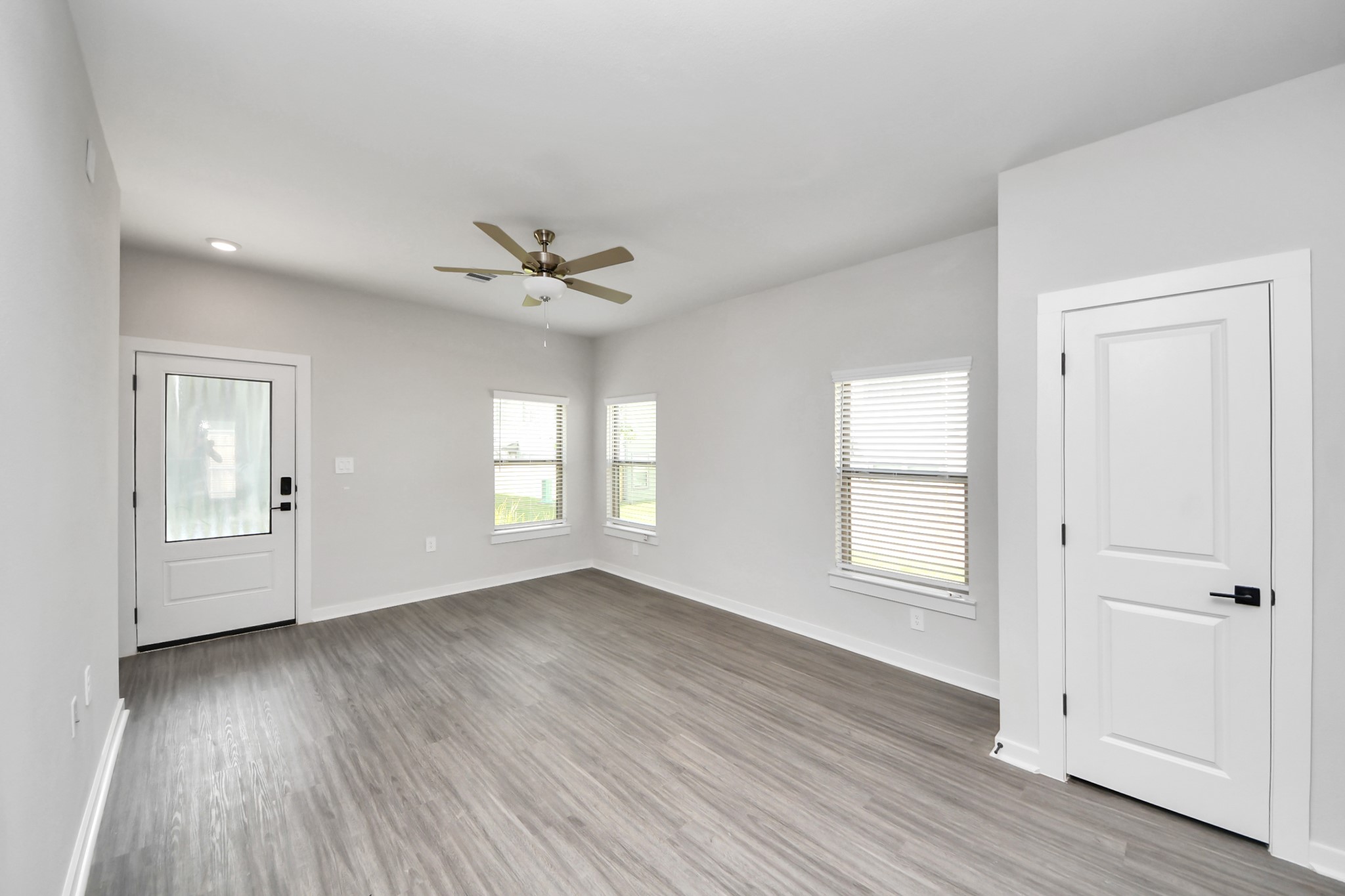 7711 Longmire Road, Unit 5 Conroe, TX 77304 - Photo 46 of 48 Open Concept Floor Plan with wood-like floors throughout!