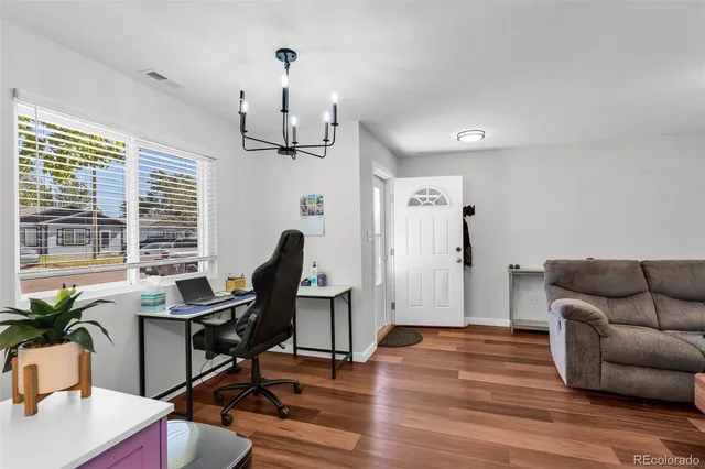 a living room with furniture rug and window