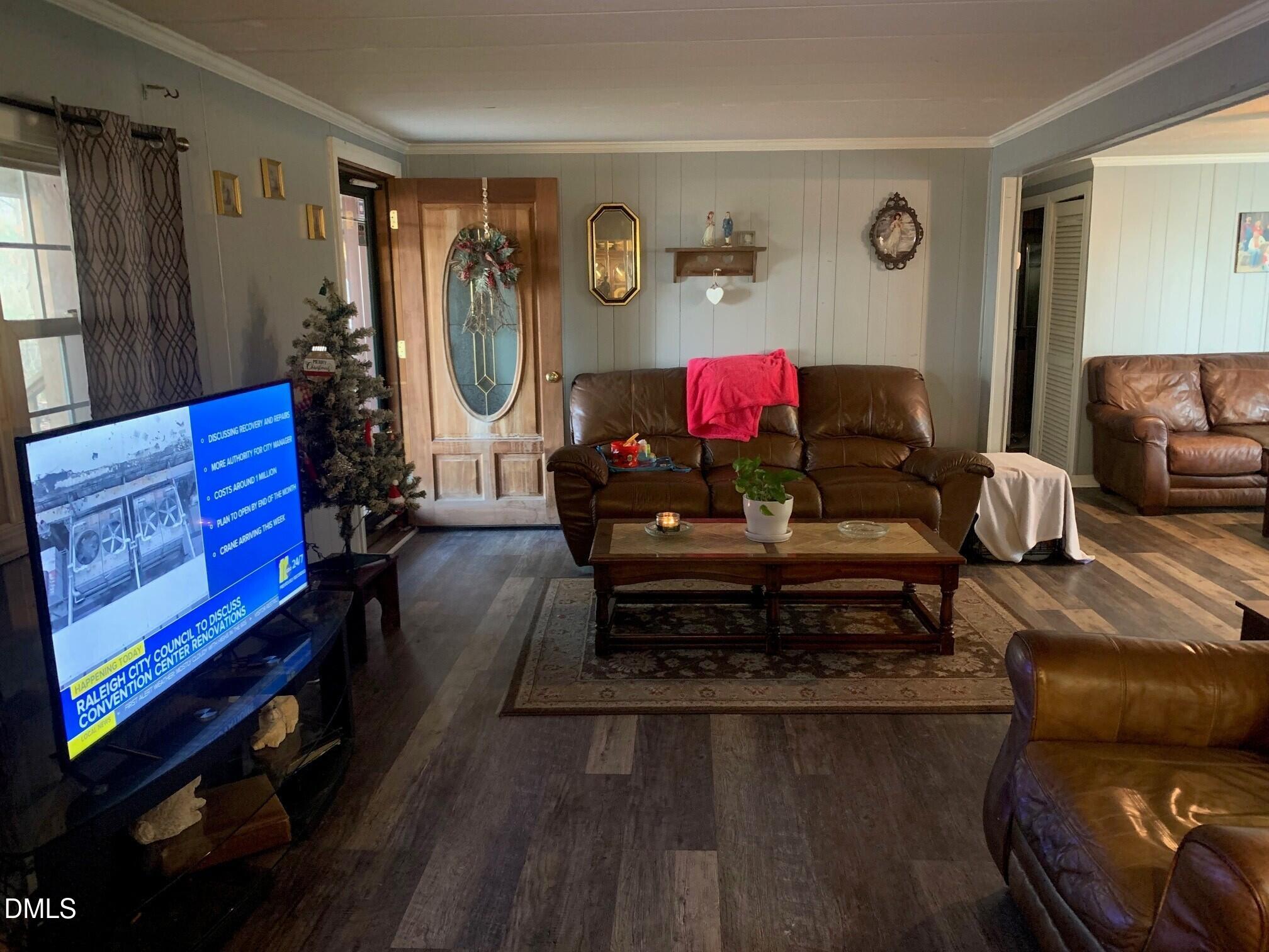 715 Patterson Road Durham, NC 27704 - Photo 4 of 18 a living room with furniture and a wooden floor