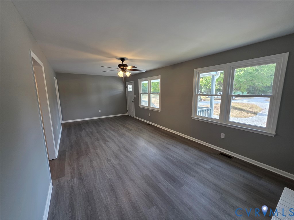 7613 Squirrel Level Road Petersburg, VA 23805 - Photo 14 of 30 Spacious room featuring lvp flooring, light gray w