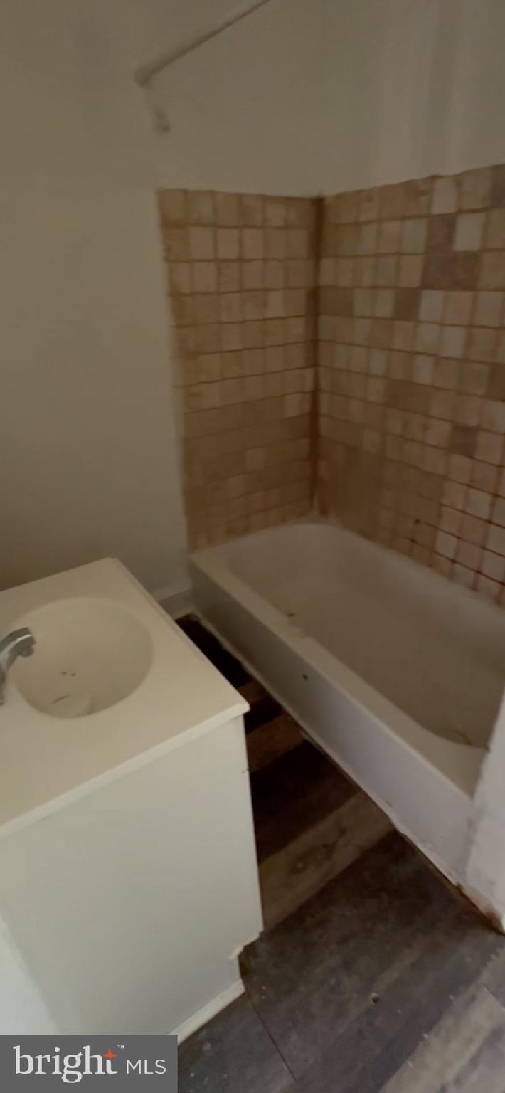 1621 South Frazier Street, Unit 2 Philadelphia, PA 19143 - Photo 3 of 5 a bathroom with a sink and a bathtub