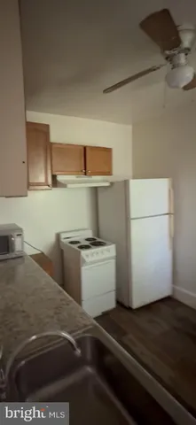 a kitchen with a stove and a refrigerator
