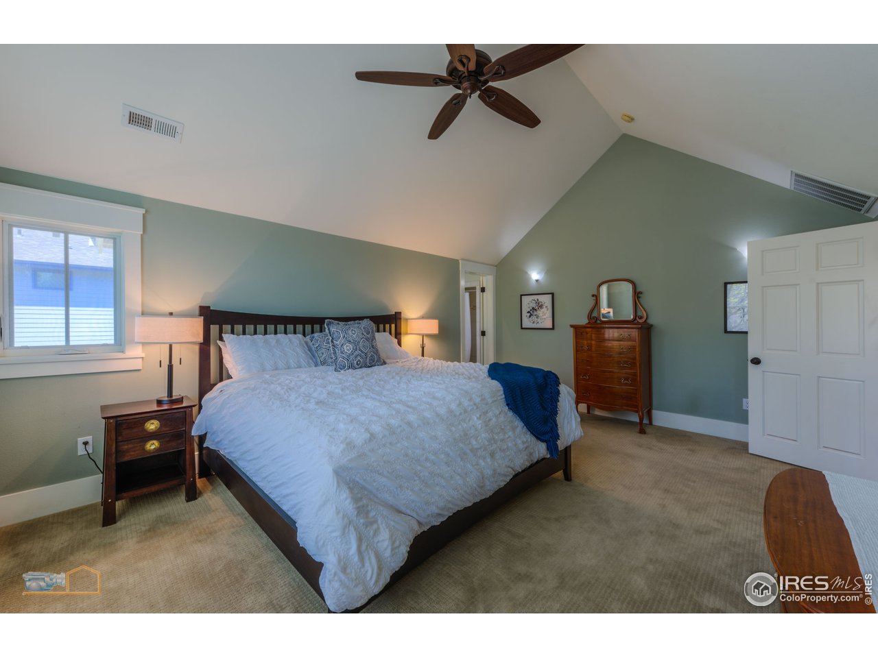 1799 Oak Avenue Boulder, CO 80304 - Photo 14 of 38 a bedroom with a bed a dresser and window
