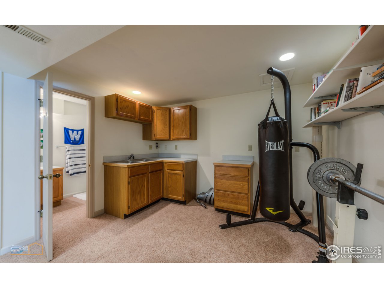 1799 Oak Avenue Boulder, CO 80304 - Photo 23 of 38 a kitchen with a refrigerator and cabinets