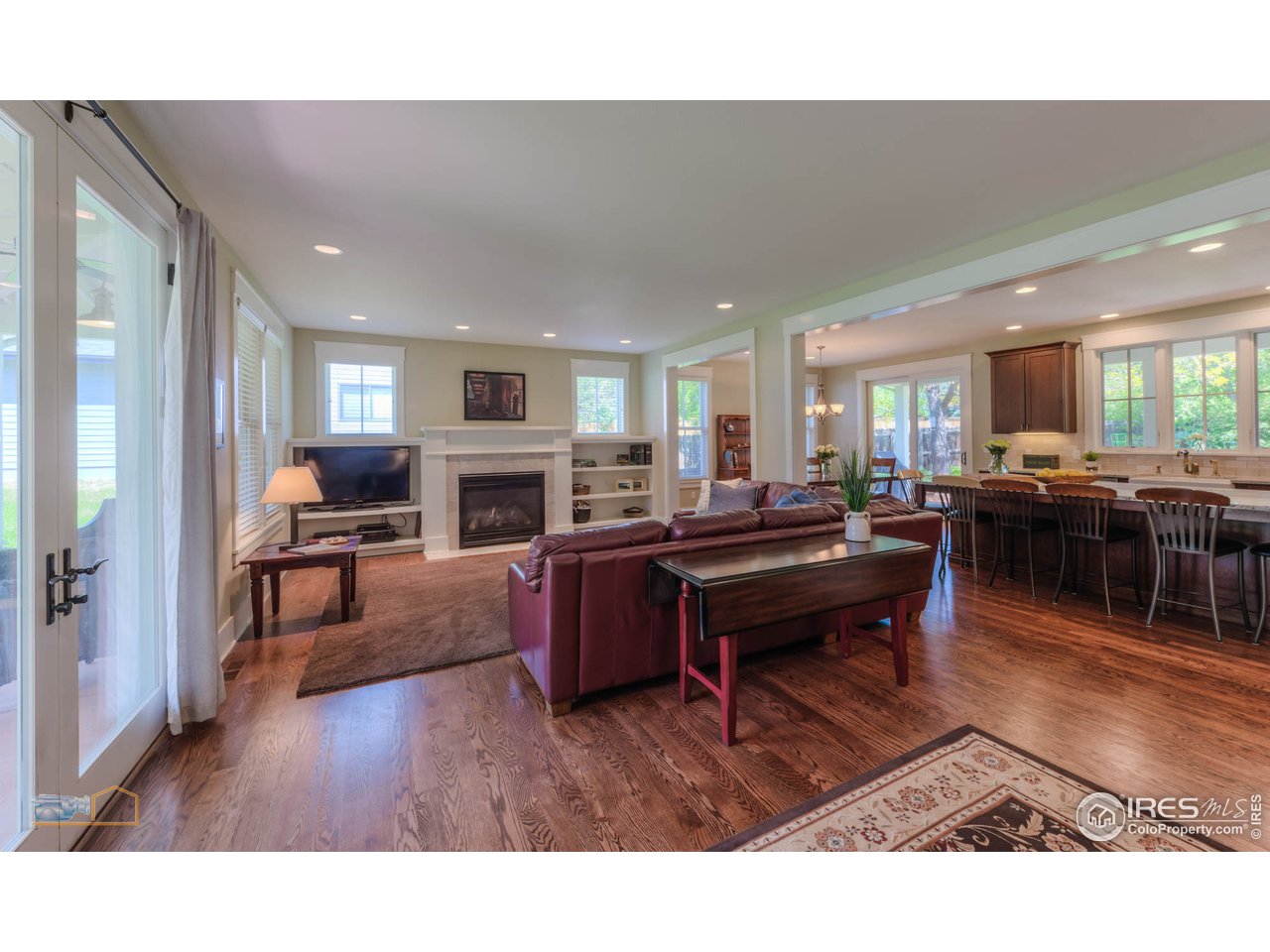 1799 Oak Avenue Boulder, CO 80304 - Photo 38 of 38 a living room with furniture a fireplace and a kitchen view