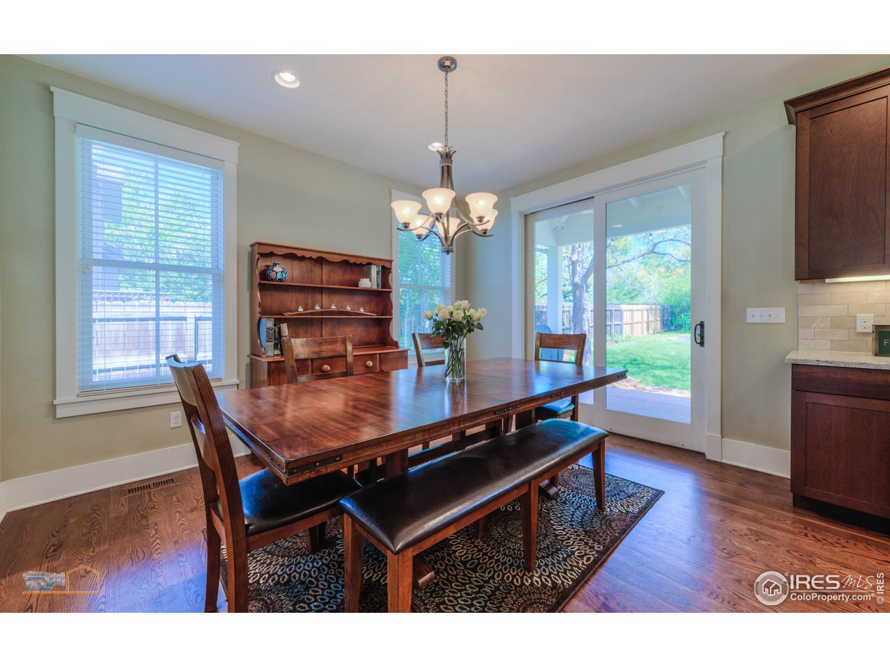 1799 Oak Avenue Boulder, CO 80304 - Photo 7 of 38 a dining room with furniture a chandelier and wooden floor
