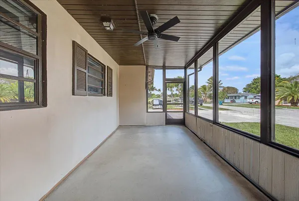 a view of an empty room with windows