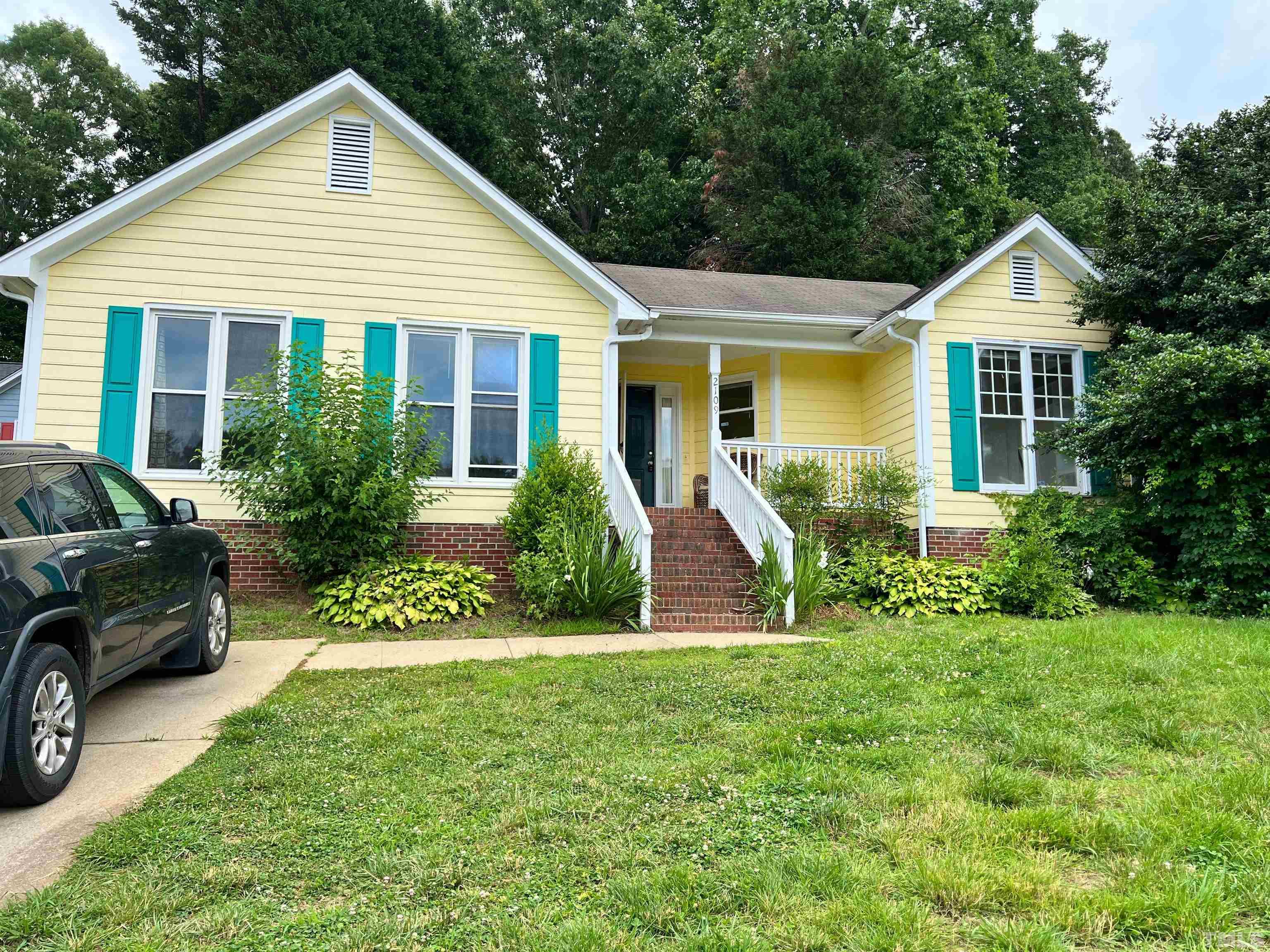 2109 Cardhu Way Raleigh, NC 27603 - Photo 1 of 40 a front view of a house with a yard