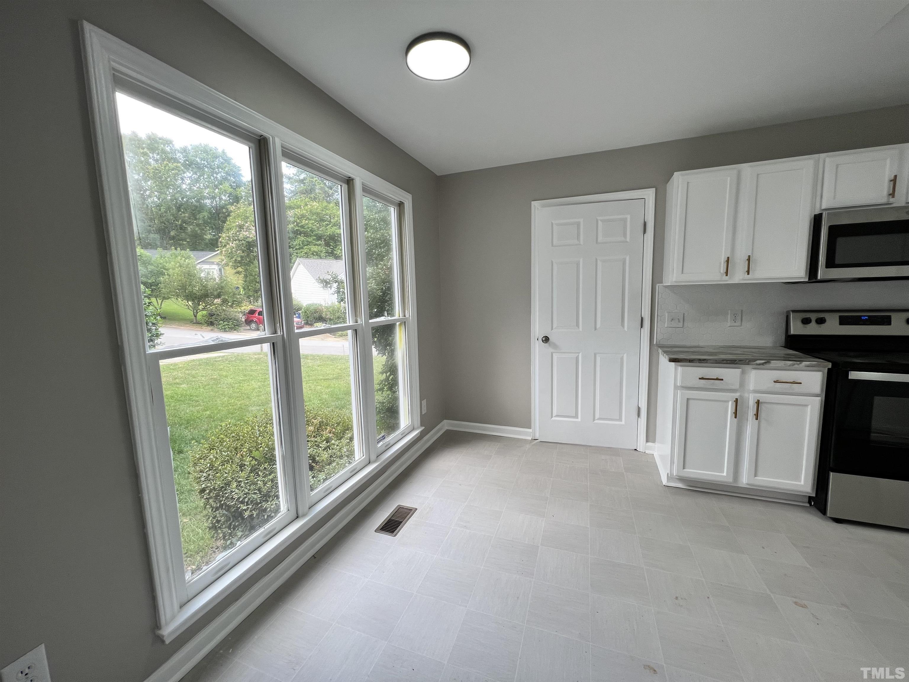 2109 Cardhu Way Raleigh, NC 27603 - Photo 12 of 40 a view of a kitchen with electric appliances