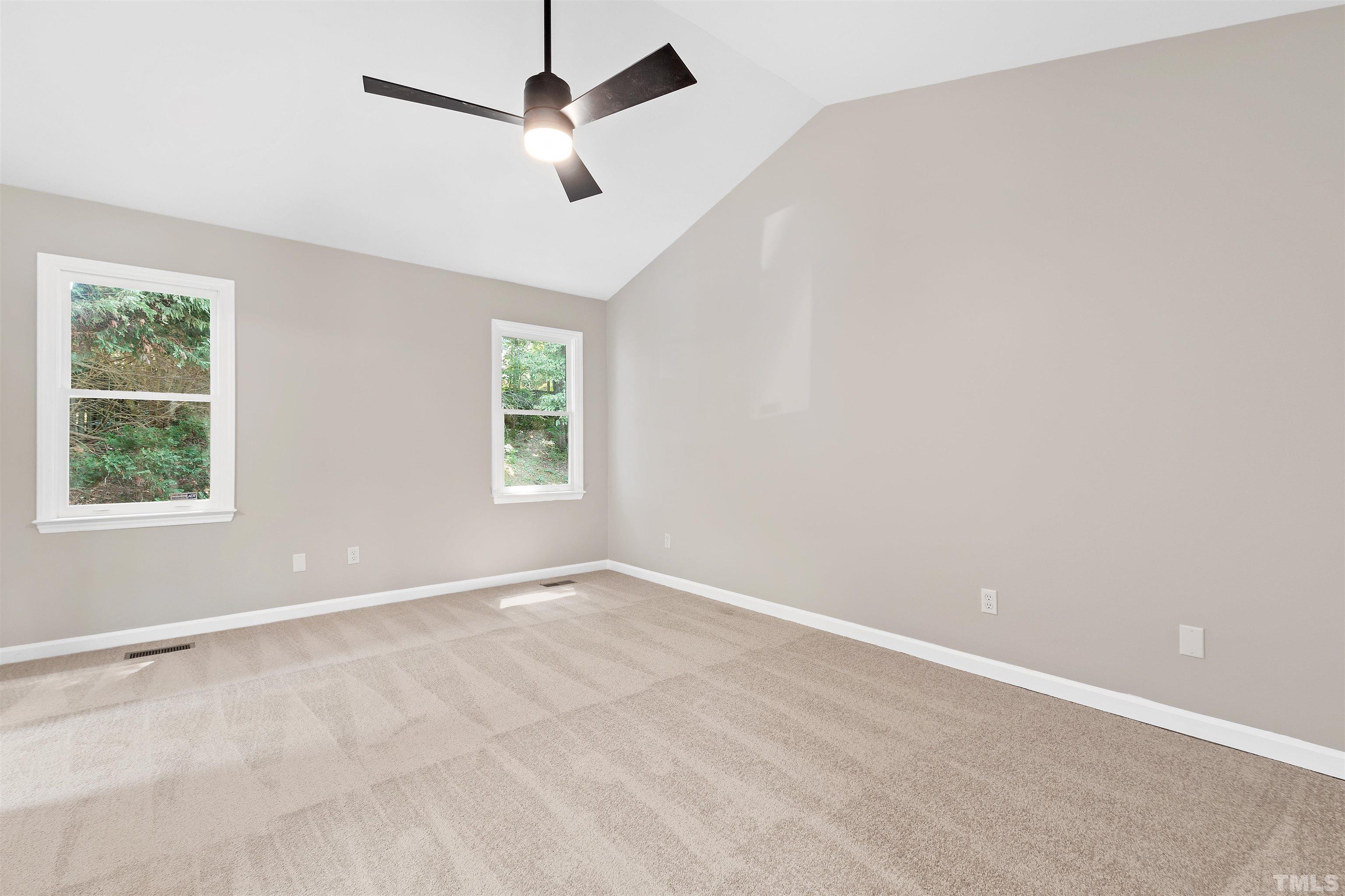 2109 Cardhu Way Raleigh, NC 27603 - Photo 13 of 40 an empty room with windows and fan