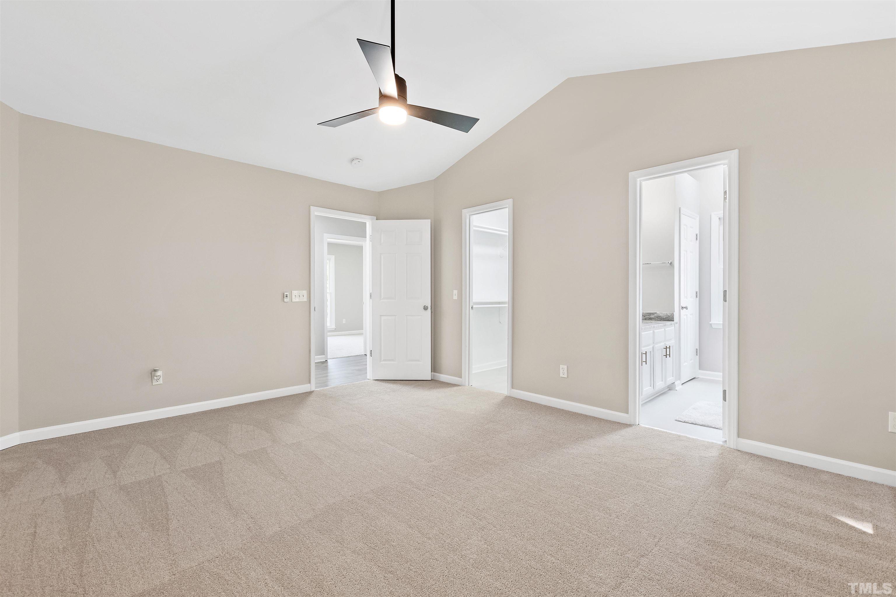 2109 Cardhu Way Raleigh, NC 27603 - Photo 15 of 40 an empty room with chandelier fan