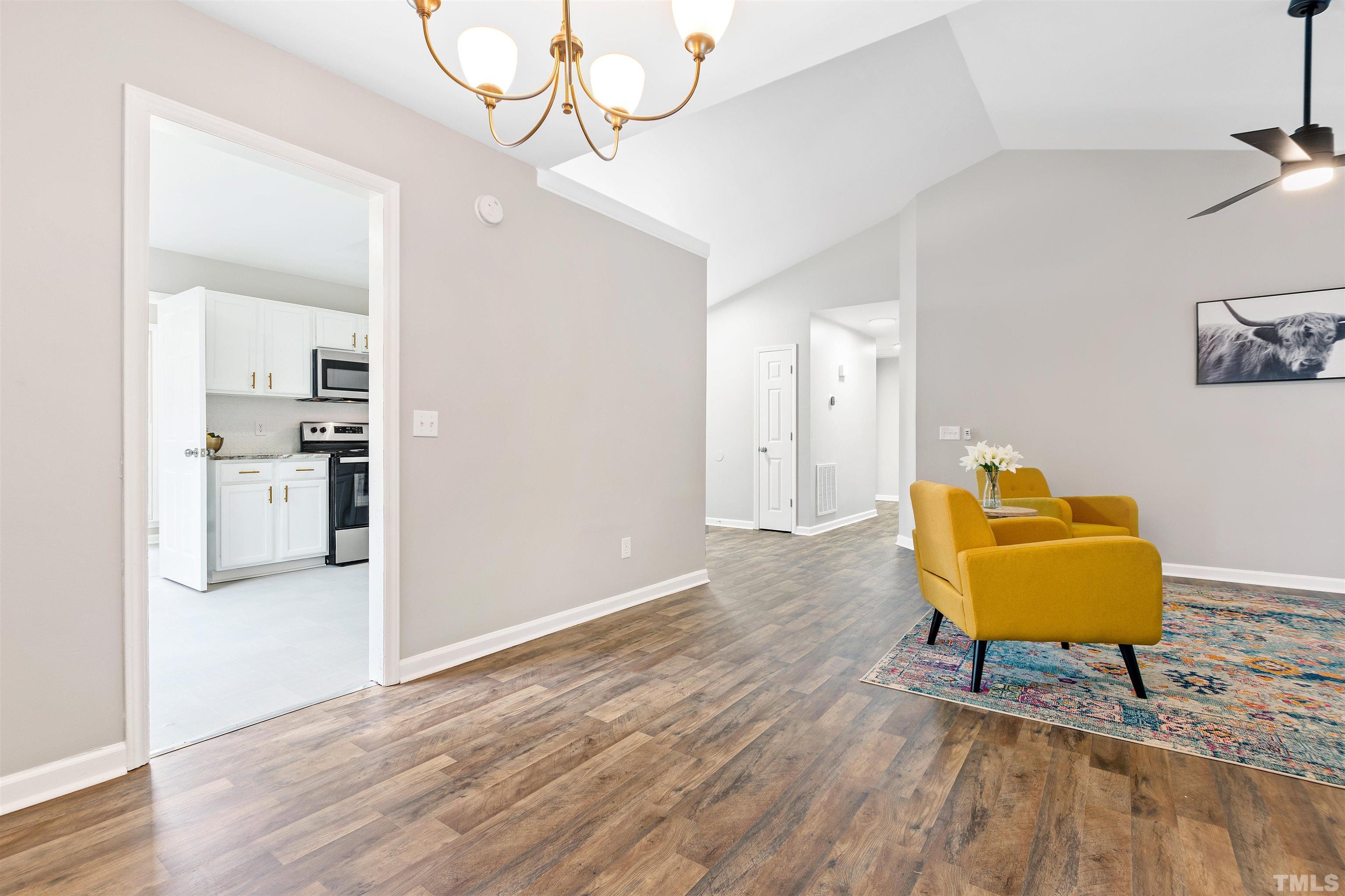 2109 Cardhu Way Raleigh, NC 27603 - Photo 17 of 40 a living room with a furniture and wooden floor