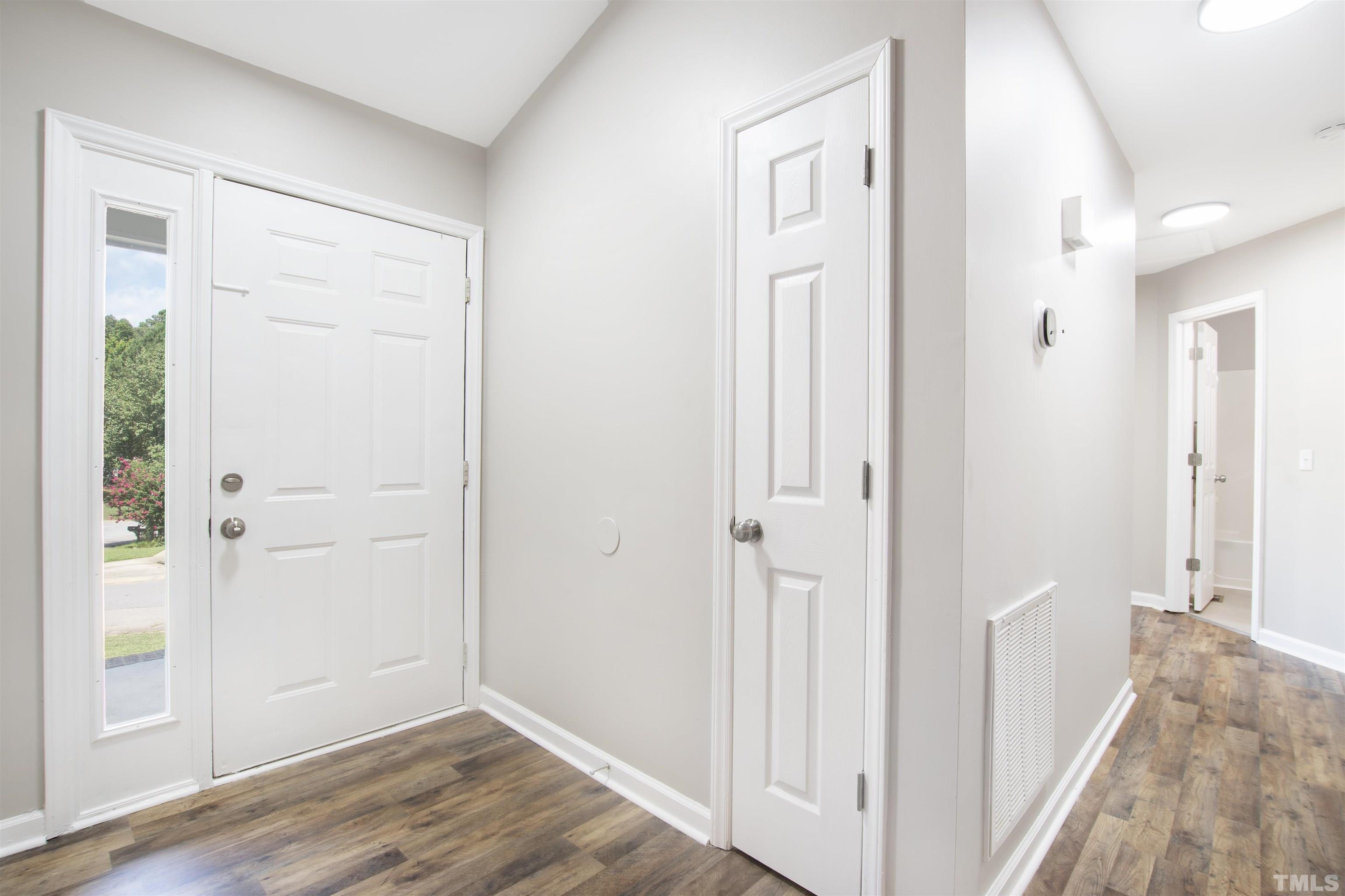 2109 Cardhu Way Raleigh, NC 27603 - Photo 21 of 40 a view of a hallway with wooden floor