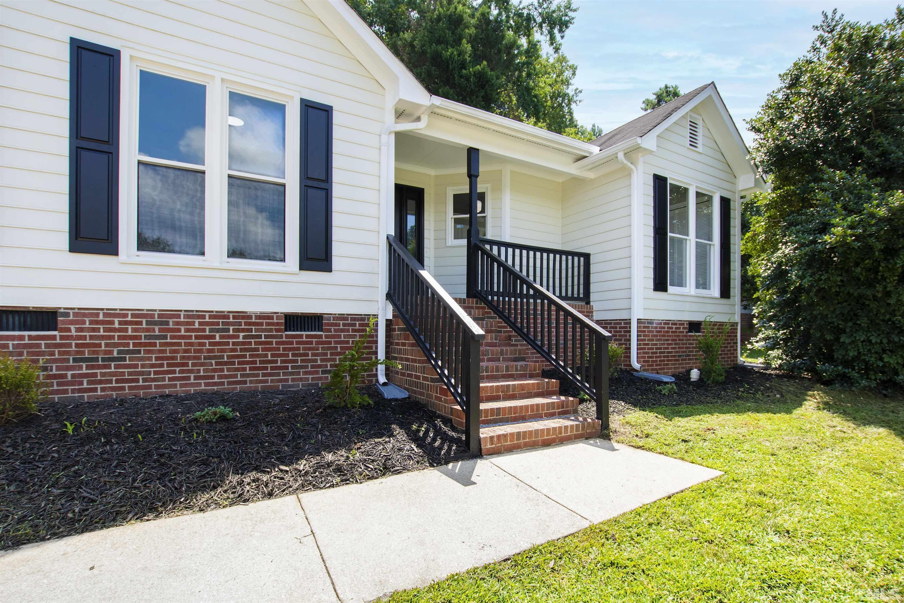 2109 Cardhu Way Raleigh, NC 27603 - Photo 22 of 40 a view of a house with backyard and wooden fence