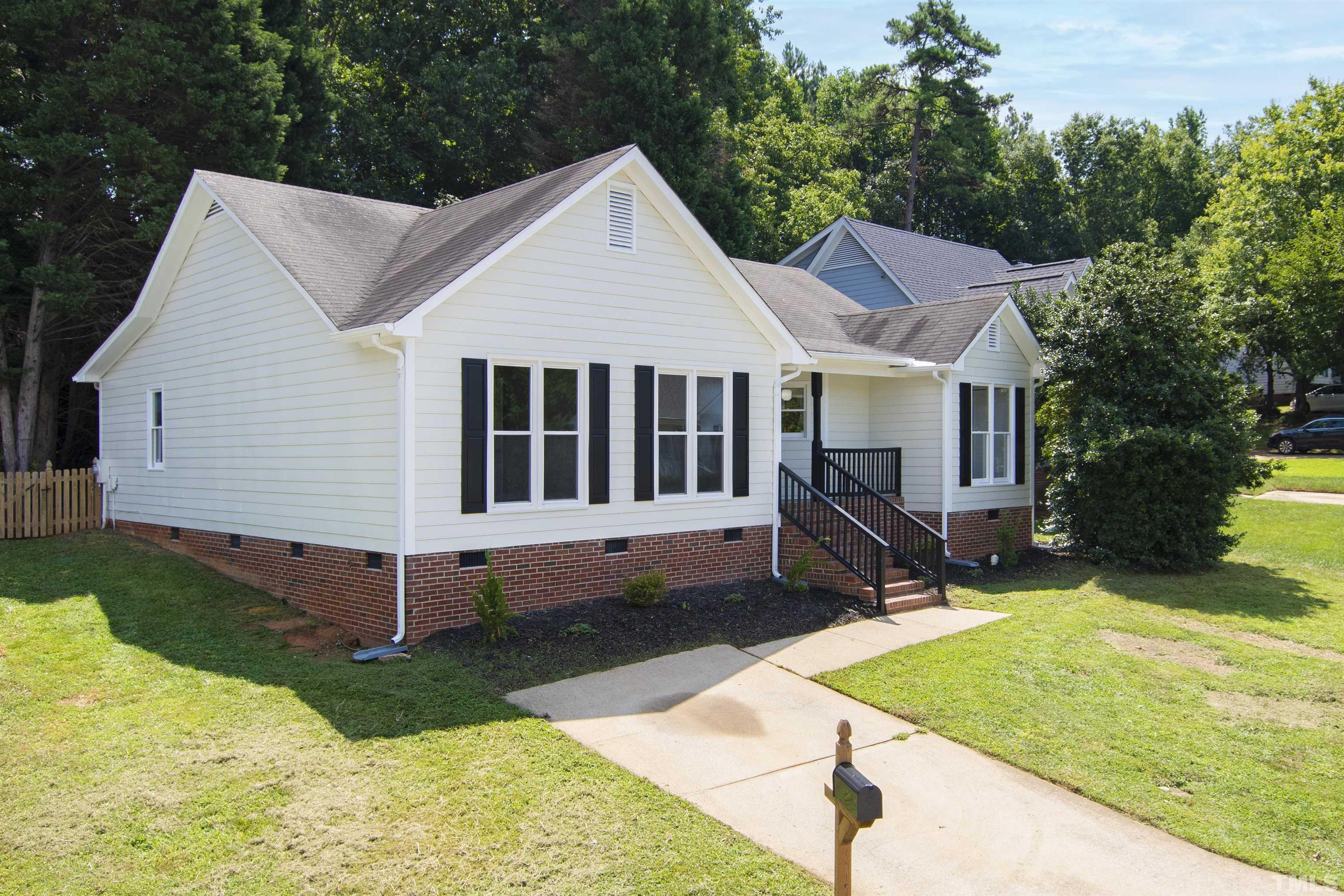 2109 Cardhu Way Raleigh, NC 27603 - Photo 23 of 40 a view of a house with a yard and sitting area