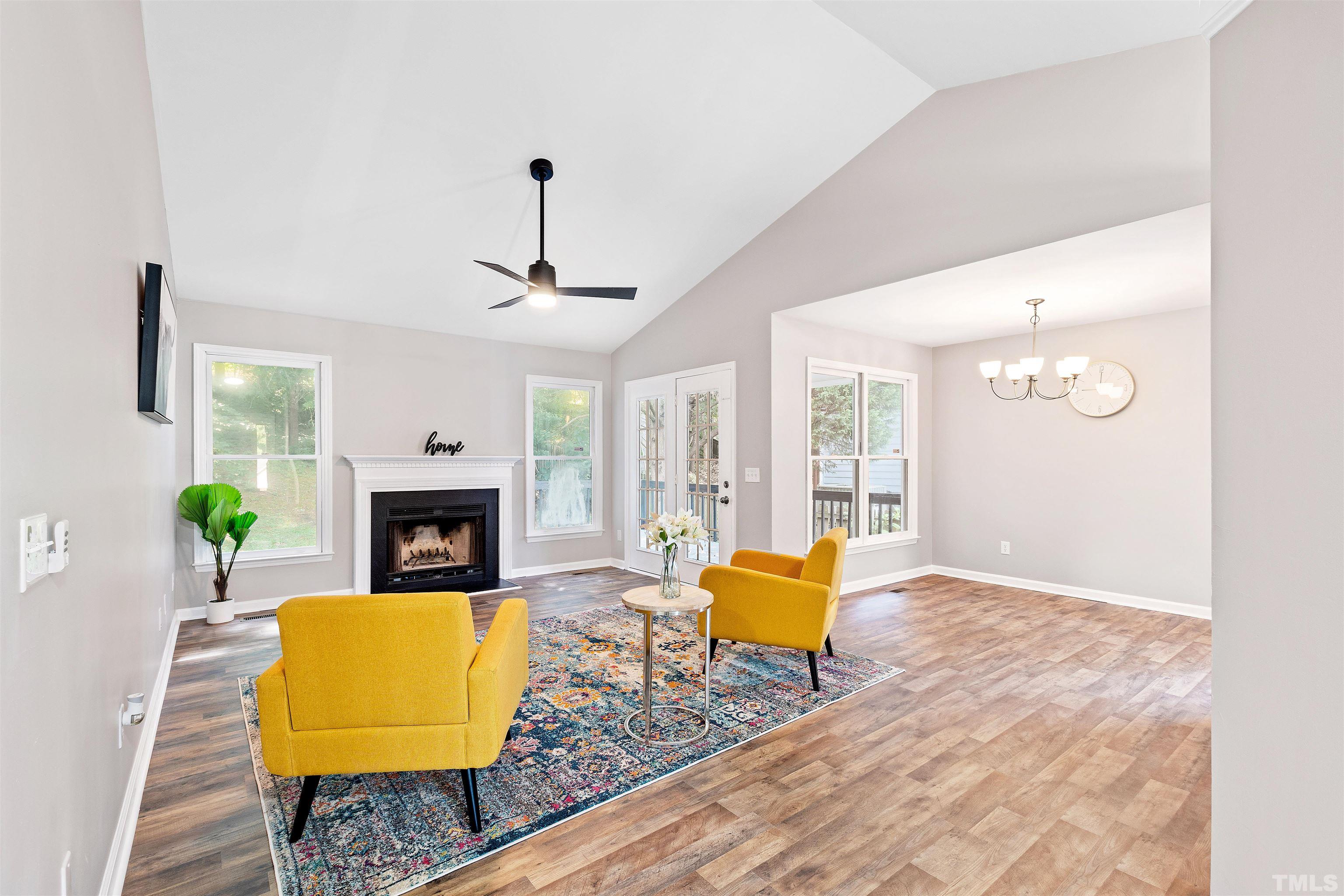 2109 Cardhu Way Raleigh, NC 27603 - Photo 34 of 40 a living room with furniture and a fireplace