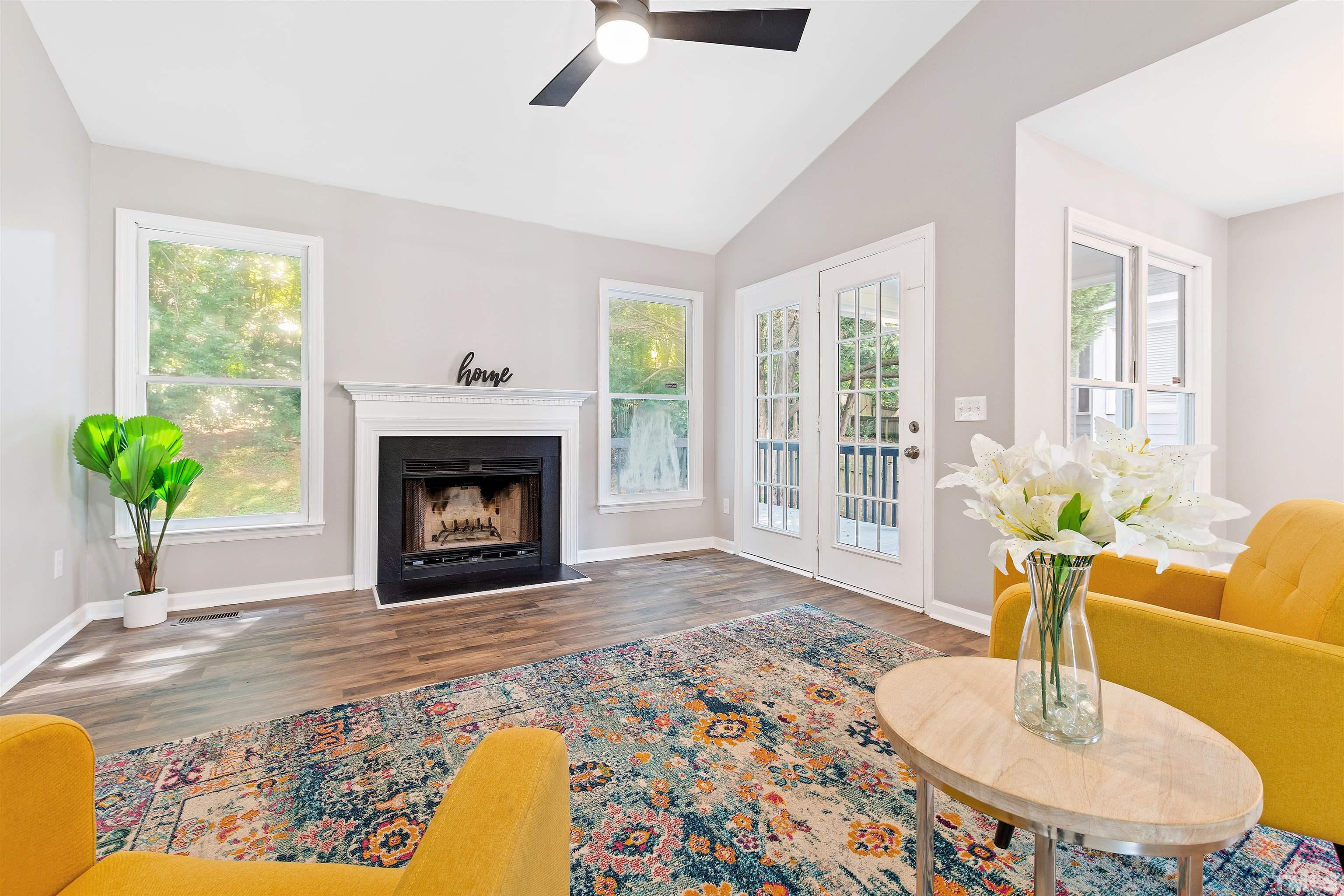 2109 Cardhu Way Raleigh, NC 27603 - Photo 35 of 40 a living room with furniture and a fireplace