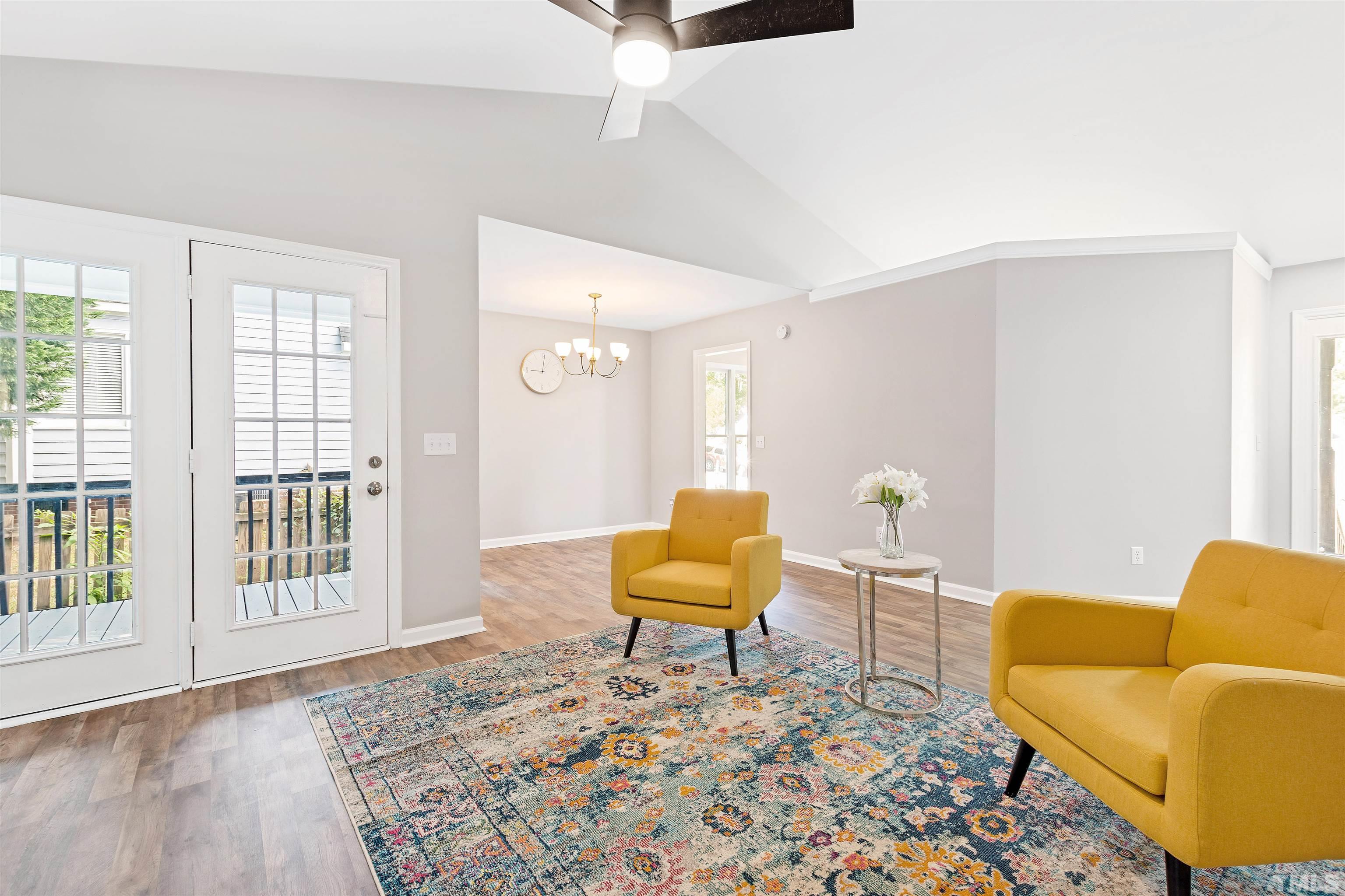 2109 Cardhu Way Raleigh, NC 27603 - Photo 36 of 40 a living room with furniture and a rug
