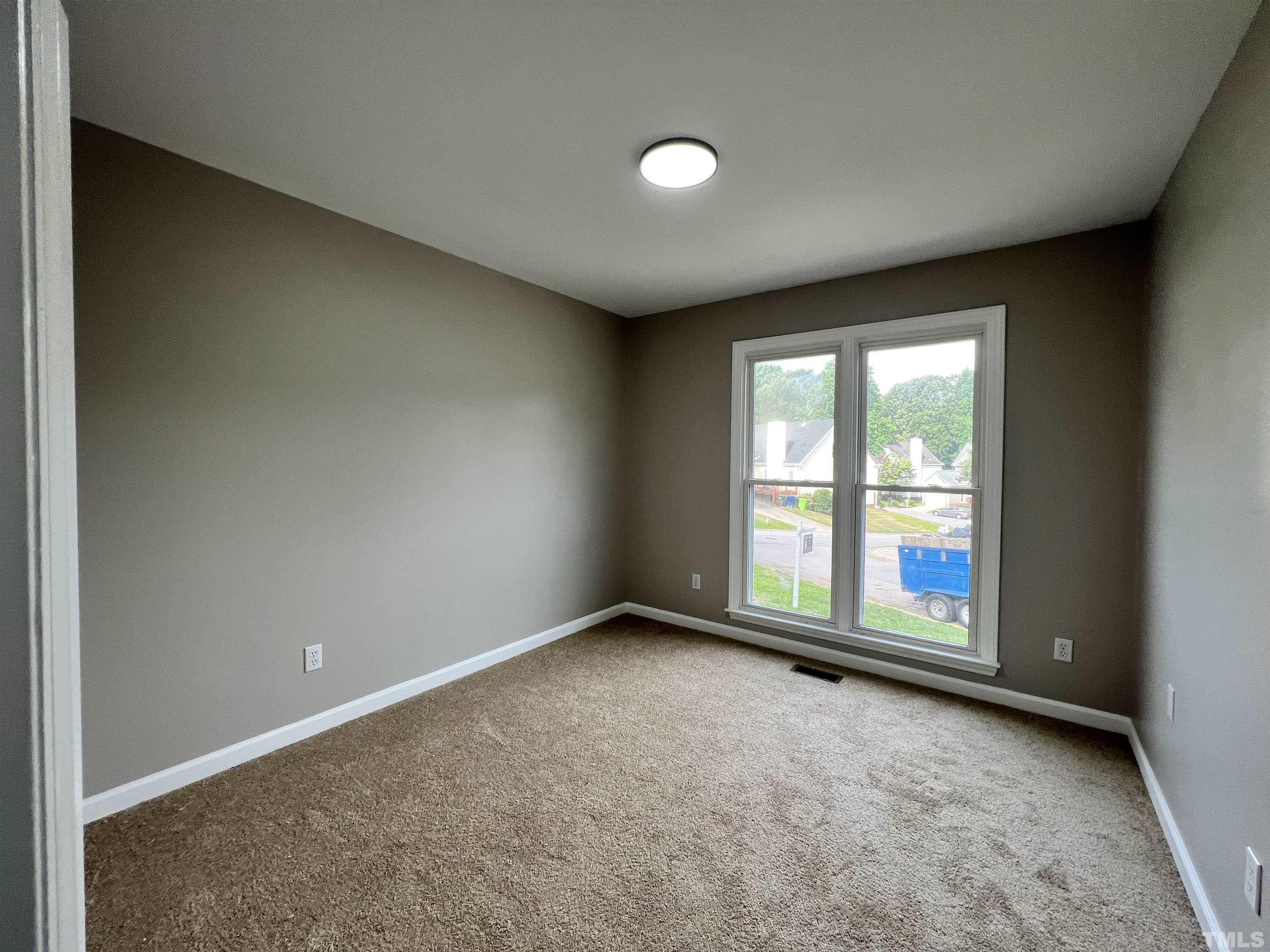 2109 Cardhu Way Raleigh, NC 27603 - Photo 8 of 40 an empty room with windows