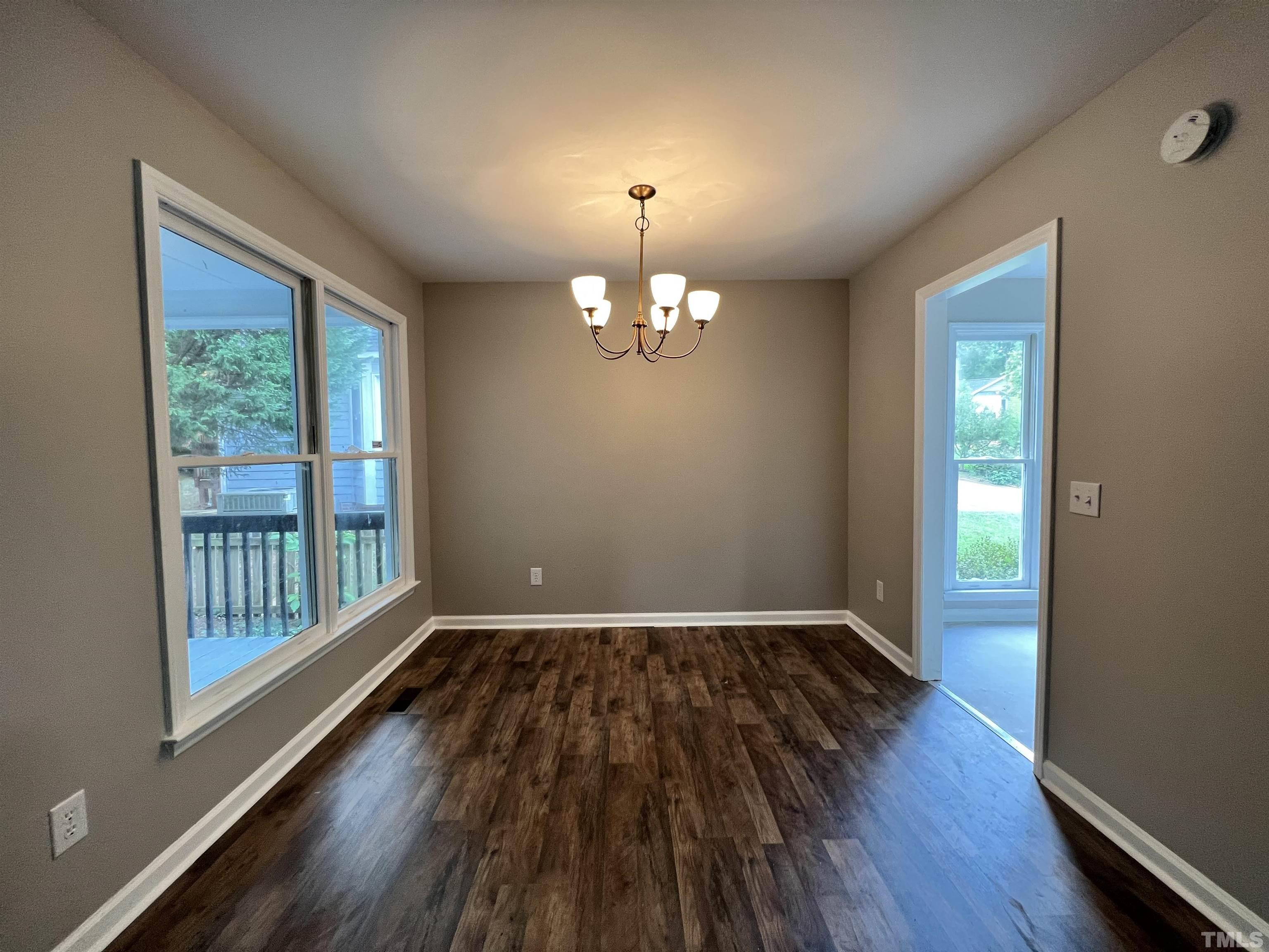 2109 Cardhu Way Raleigh, NC 27603 - Photo 10 of 40 wooden floor in an empty room with a window