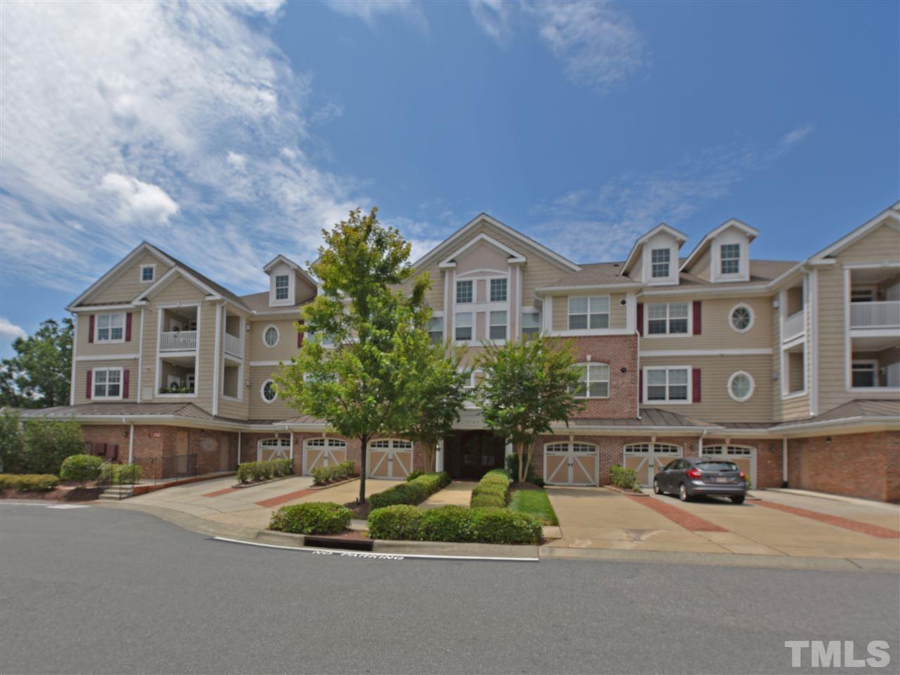 10411 Rosegate Court, Unit 5 Raleigh, NC 27617 - Photo 1 of 24 a front view of a house with a yard