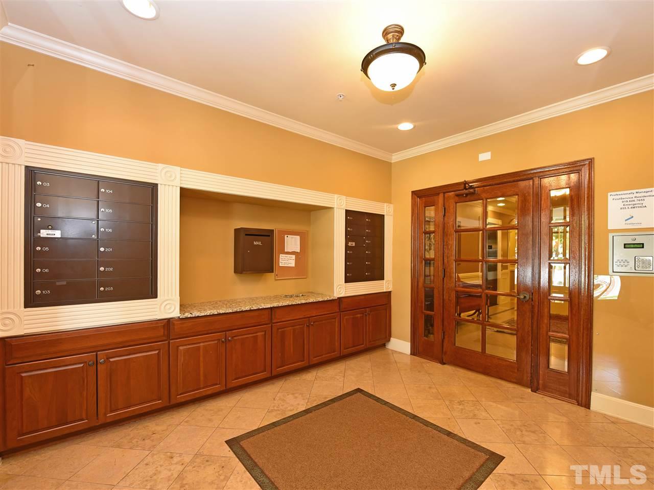 10411 Rosegate Court, Unit 5 Raleigh, NC 27617 - Photo 2 of 24 a spacious bathroom with a sink a mirror and a shower