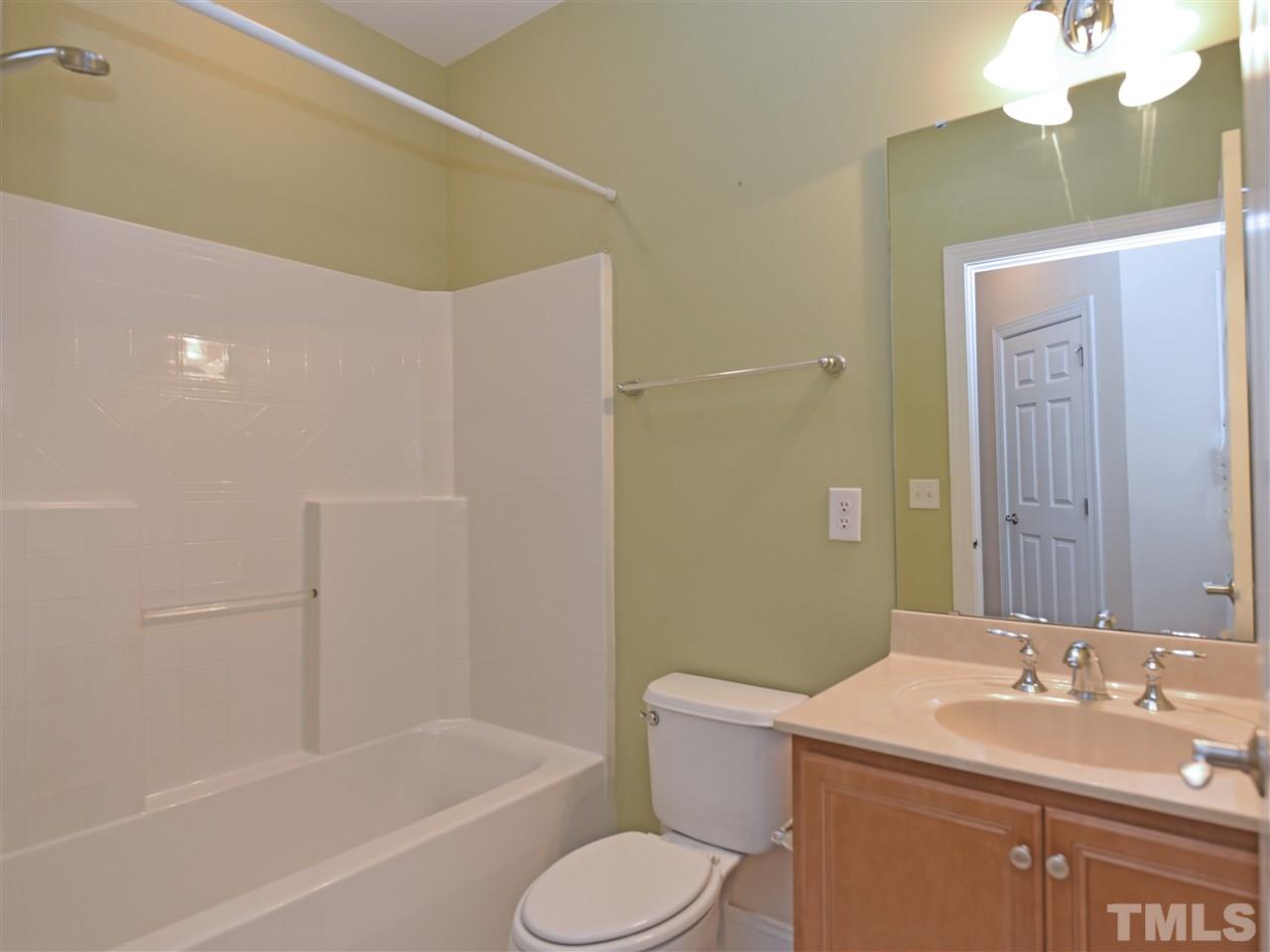 10411 Rosegate Court, Unit 5 Raleigh, NC 27617 - Photo 17 of 24 a bathroom with a granite countertop sink toilet and shower