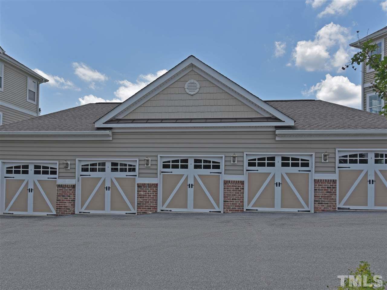 10411 Rosegate Court, Unit 5 Raleigh, NC 27617 - Photo 21 of 24 a view of a garage with a white roof