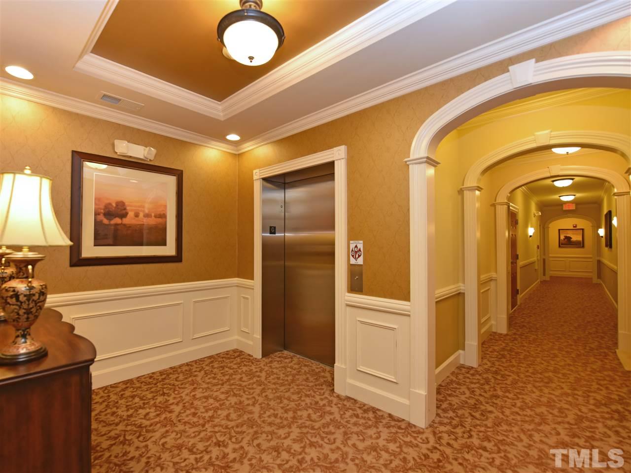 10411 Rosegate Court, Unit 5 Raleigh, NC 27617 - Photo 4 of 24 a view of a hallway view with wooden floor and staircase