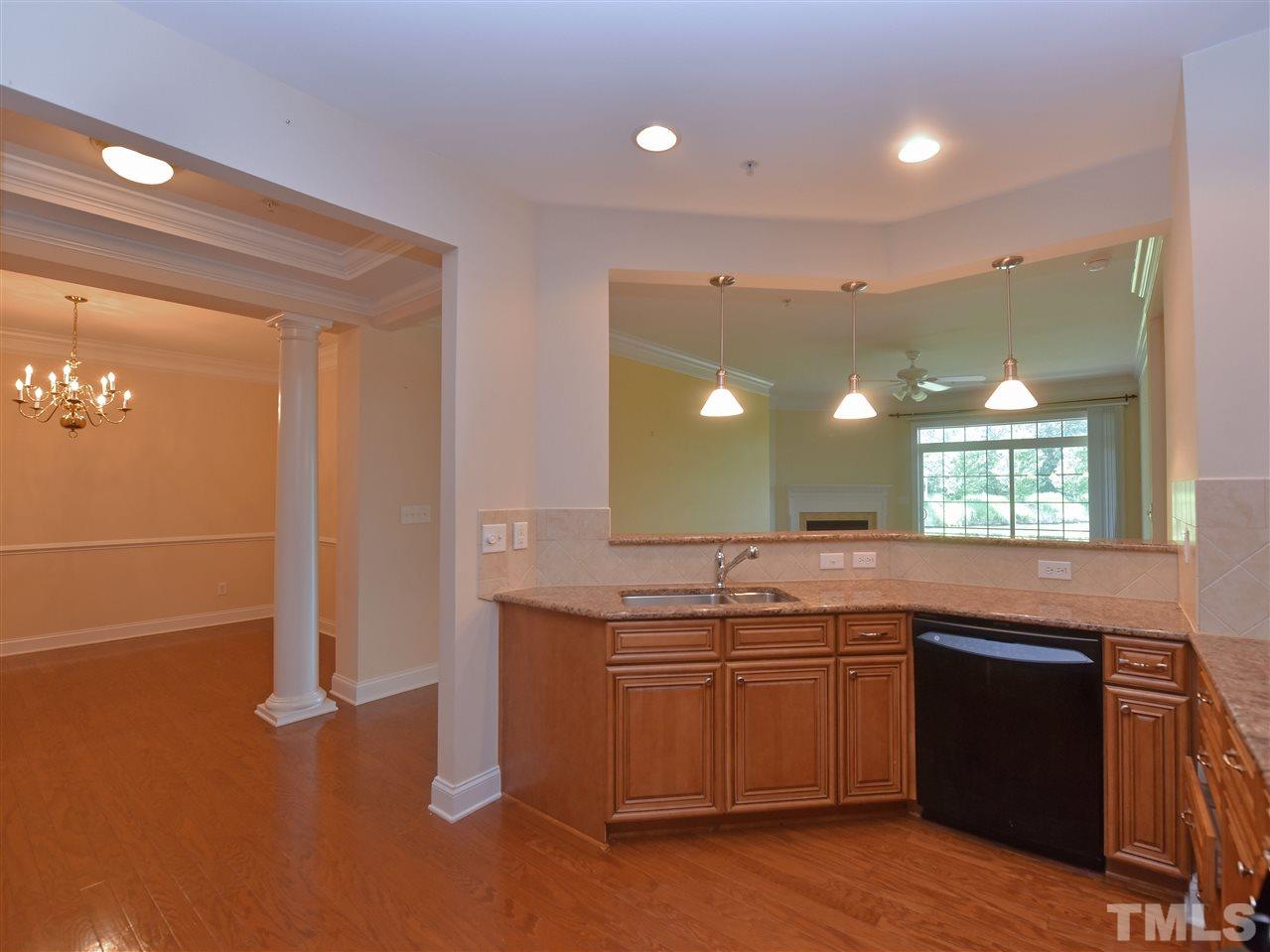 10411 Rosegate Court, Unit 5 Raleigh, NC 27617 - Photo 9 of 24 a kitchen with a sink and a stove top oven