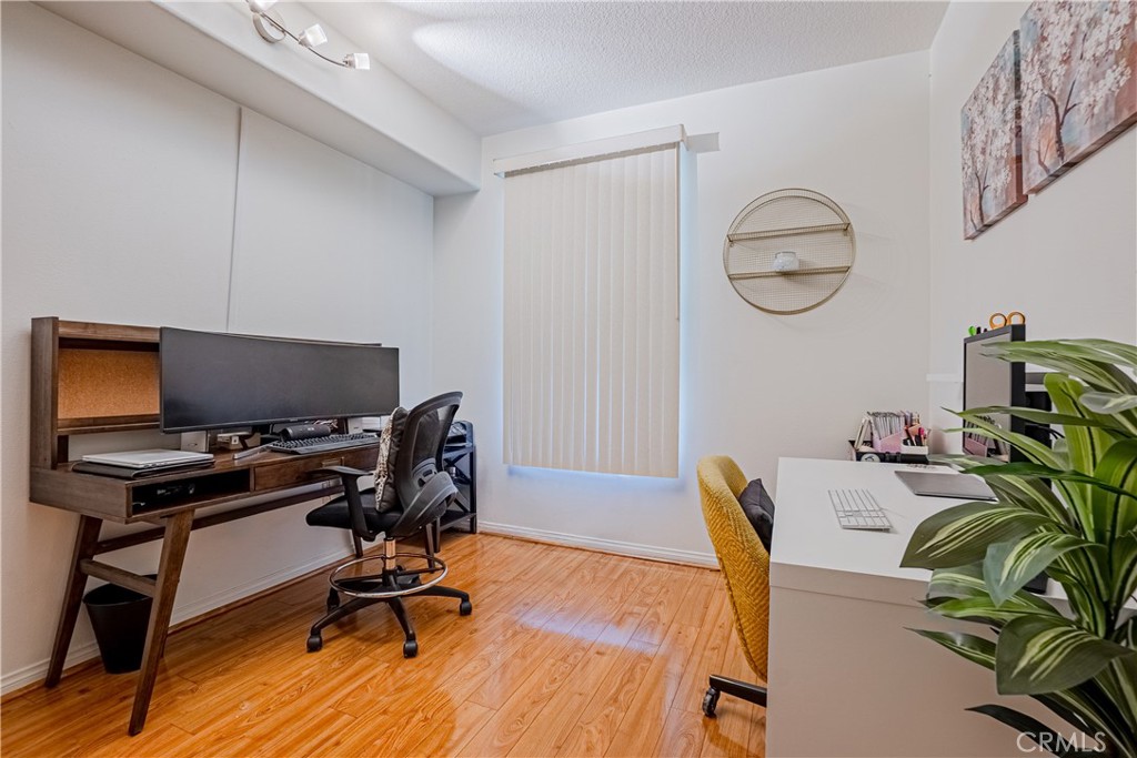 12668 Chapman Avenue, Unit 2108 Garden Grove, CA 92840 - Photo 21 of 40 a view of a workspace with furniture and a window