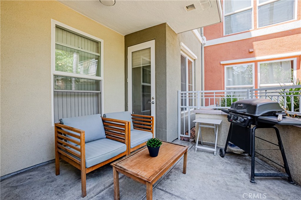 12668 Chapman Avenue, Unit 2108 Garden Grove, CA 92840 - Photo 24 of 40 a outdoor living space with furniture and a window