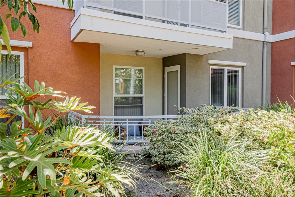 12668 Chapman Avenue, Unit 2108 Garden Grove, CA 92840 - Photo 25 of 40 front view of a house with a flower garden
