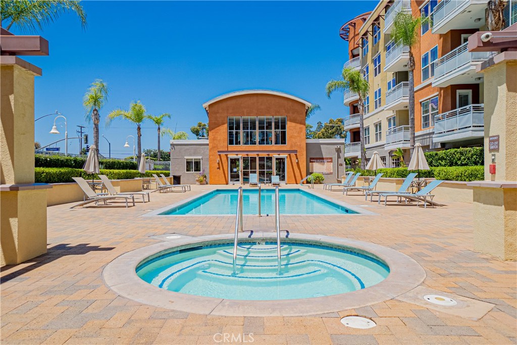 12668 Chapman Avenue, Unit 2108 Garden Grove, CA 92840 - Photo 28 of 40 a swimming pool with outdoor seating and yard