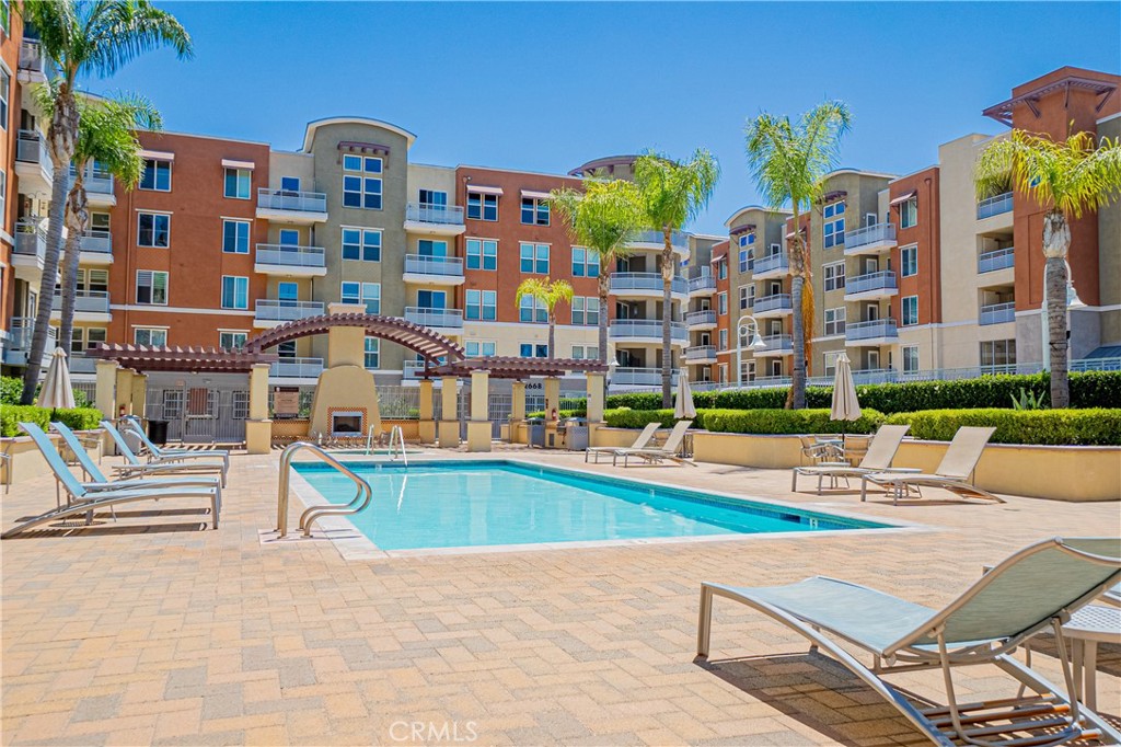 12668 Chapman Avenue, Unit 2108 Garden Grove, CA 92840 - Photo 29 of 40 a front view of building with outdoor seating