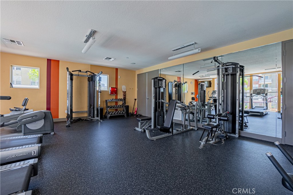 12668 Chapman Avenue, Unit 2108 Garden Grove, CA 92840 - Photo 32 of 40 a view of a room with gym equipment