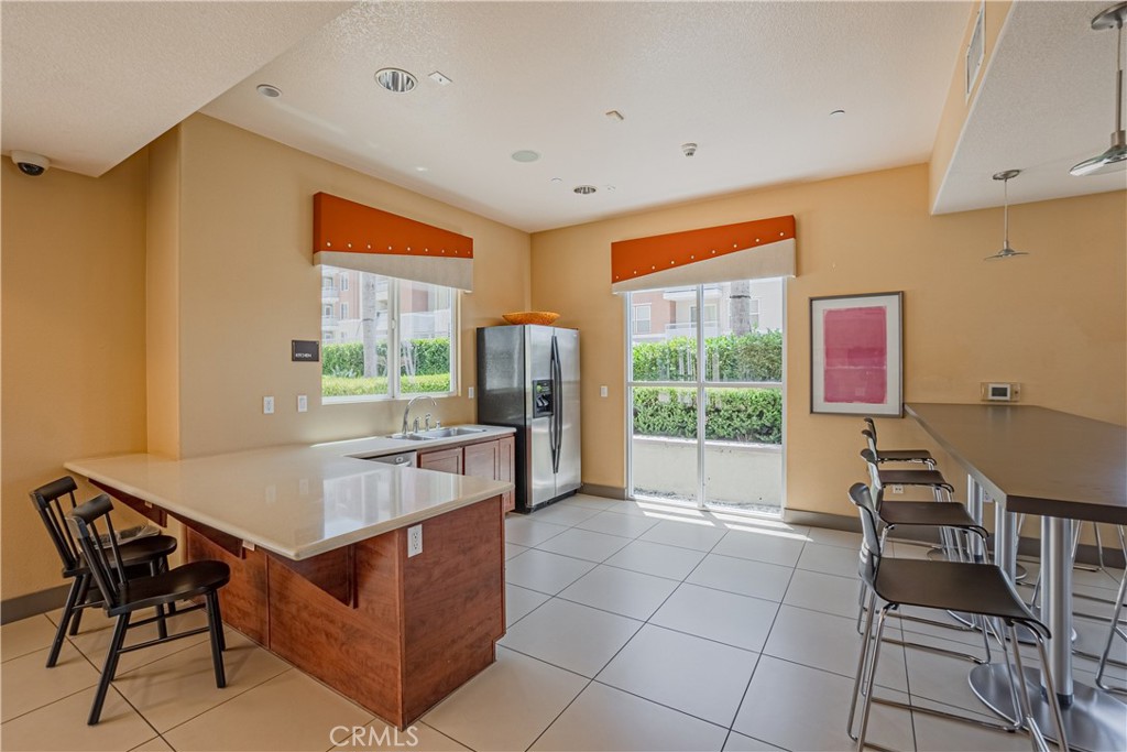 12668 Chapman Avenue, Unit 2108 Garden Grove, CA 92840 - Photo 34 of 40 a room with furniture and a window