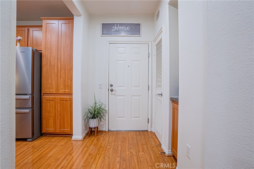 12668 Chapman Avenue, Unit 2108 Garden Grove, CA 92840 - Photo 8 of 40 a view of a livingroom with wooden floor