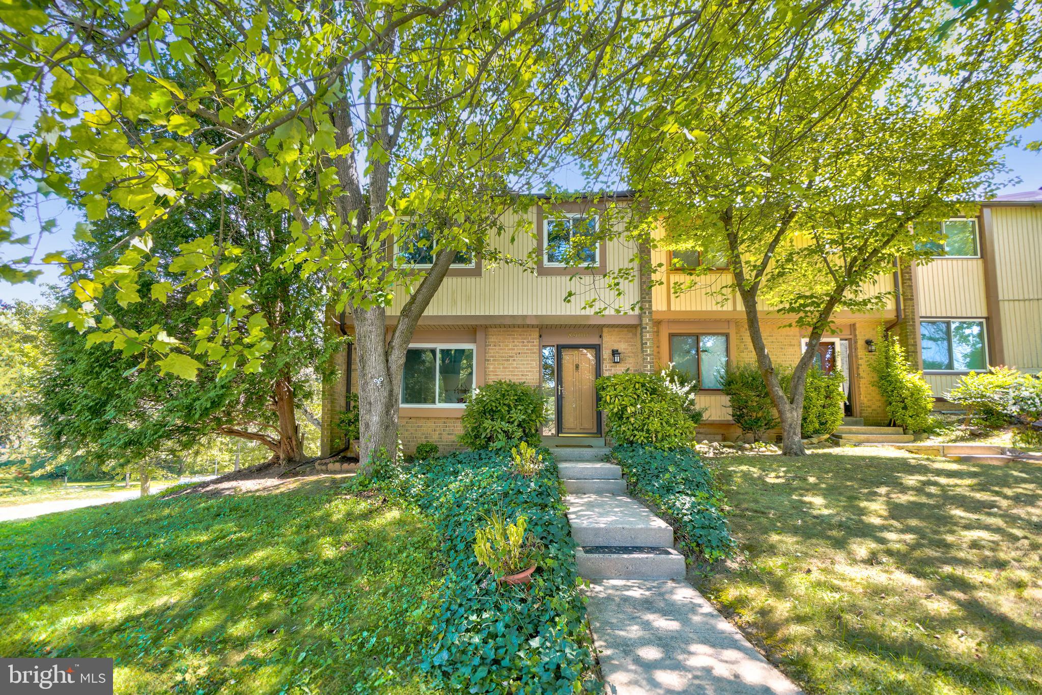 8900 Centerway Road Gaithersburg, MD 20879 - Photo 1 of 32 a front view of a house with a yard