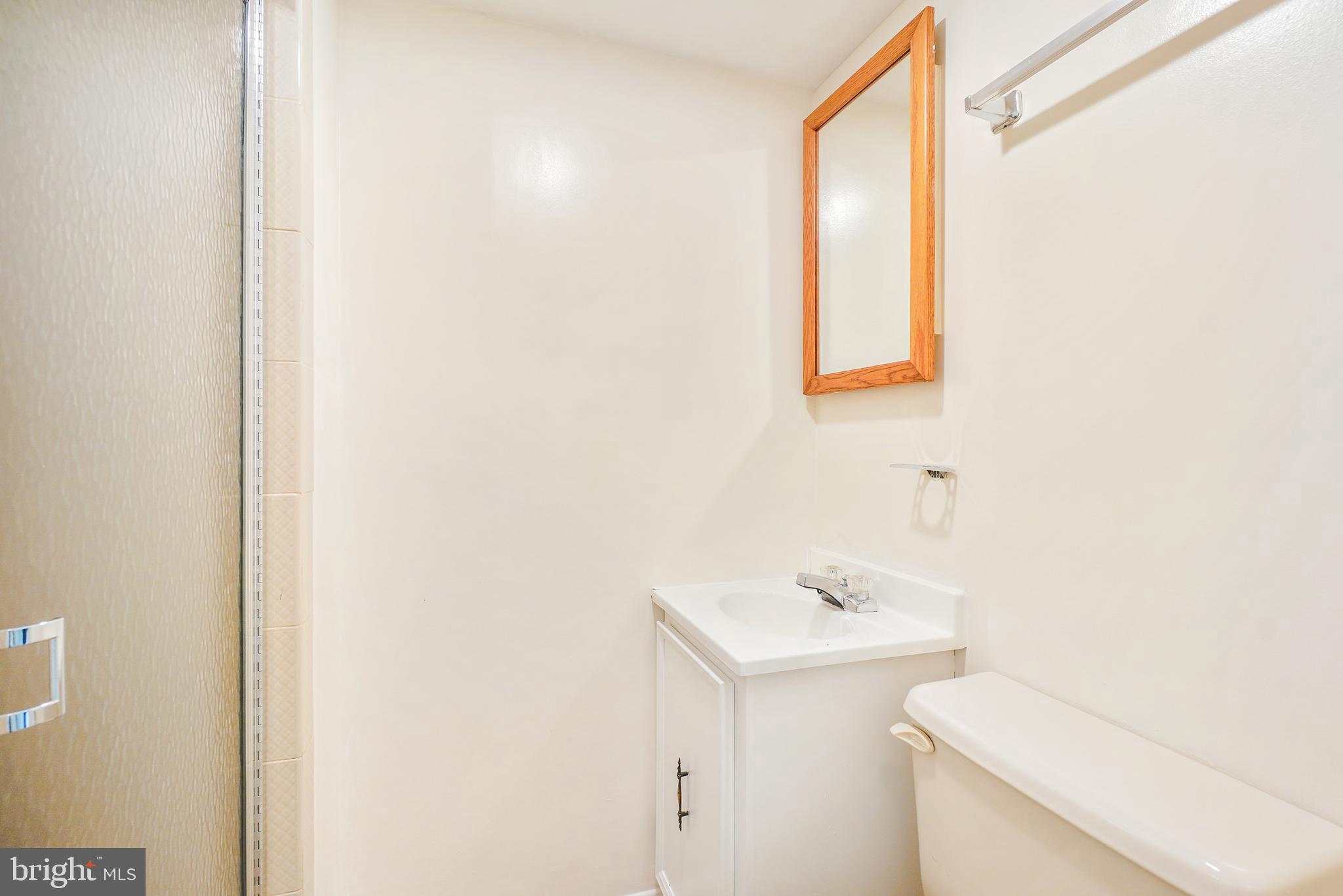 8900 Centerway Road Gaithersburg, MD 20879 - Photo 26 of 32 a bathroom with a sink and a mirror