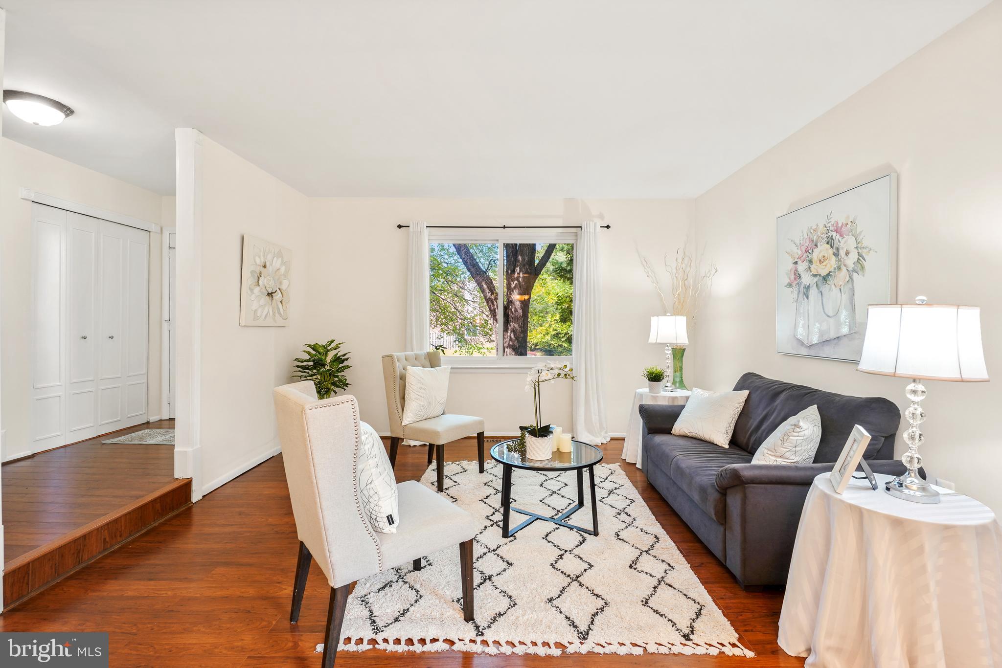 8900 Centerway Road Gaithersburg, MD 20879 - Photo 4 of 32 a living room with furniture and a large window