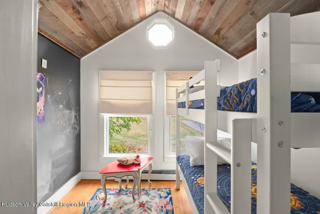 a bedroom with furniture and a window