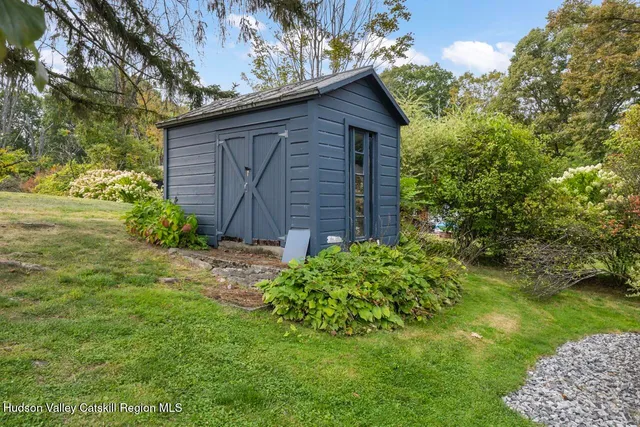 a view of a backyard with potted plants